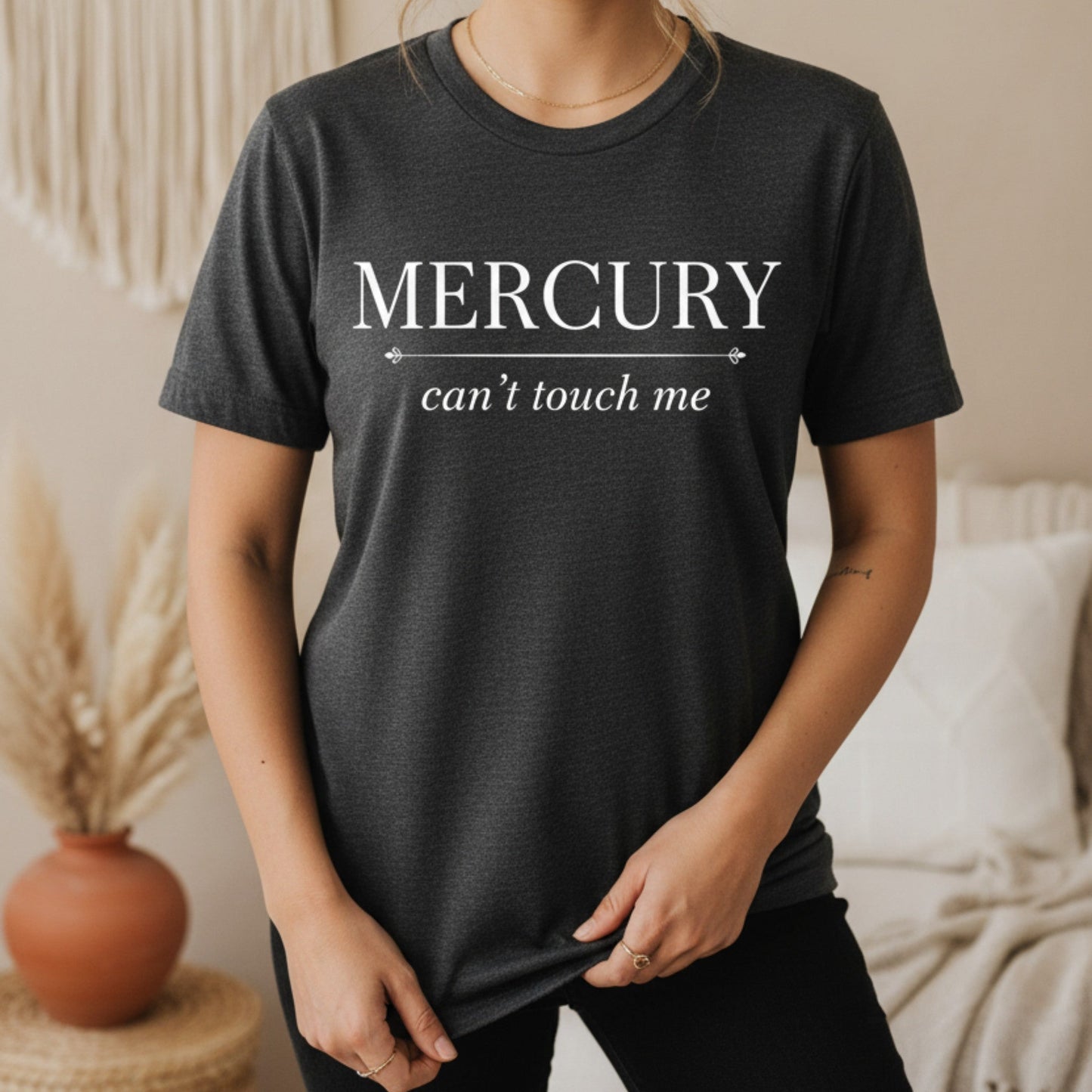 Dark gray heather Mercury Can't Touch Me tee with white serif print — cozy everyday astrology shirt for the grounded spiritual woman who moves through life with quiet confidence