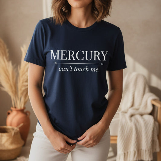 Navy Mercury Can't Touch Me tee with white serif and script astrology print — witty retrograde gift for the spiritual woman who stays grounded no matter what Mercury is doing