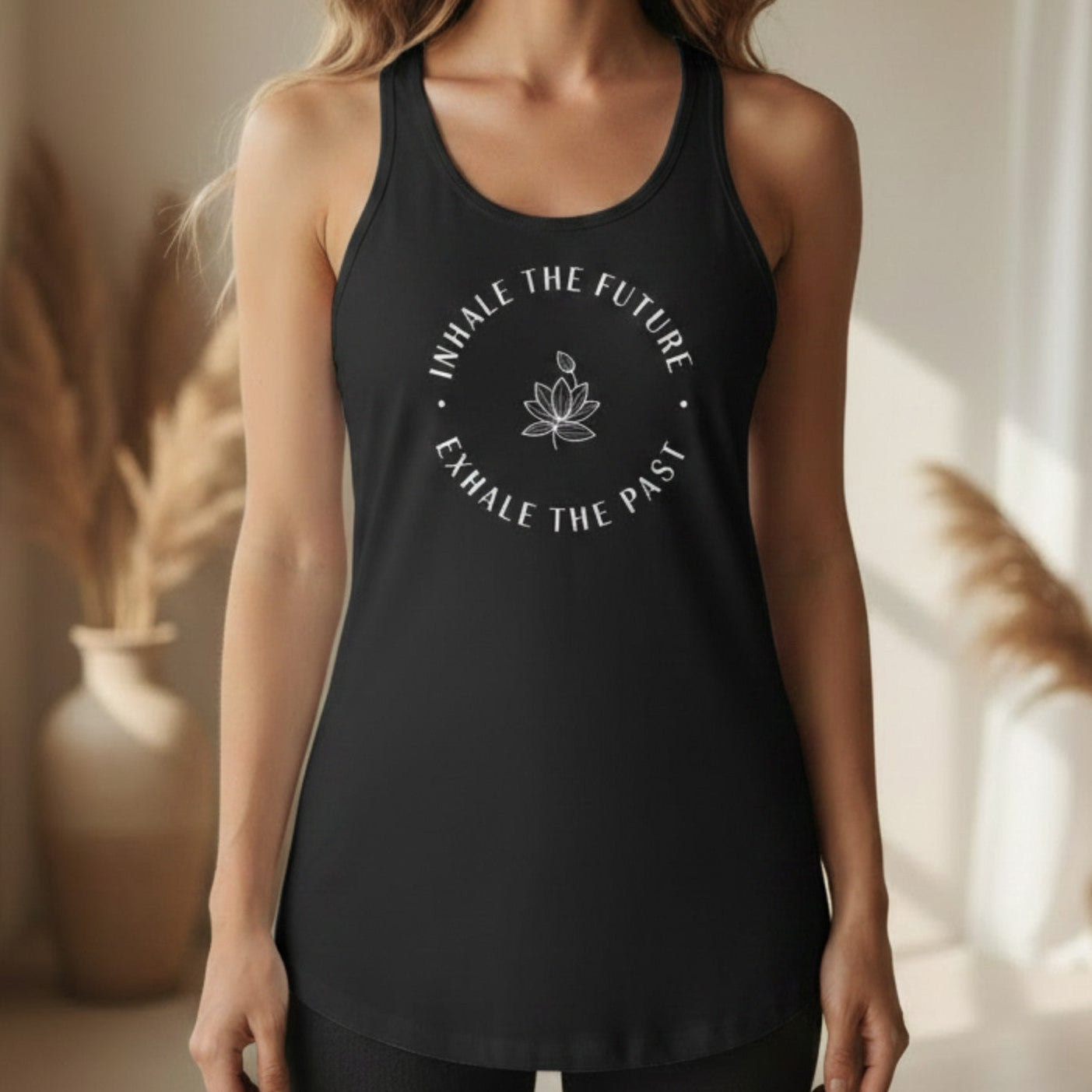 Black Inhale the Future Exhale the Past racerback tank with white lotus badge print — bold mindfulness gift for the woman who is letting go and stepping into her future one breath at a time