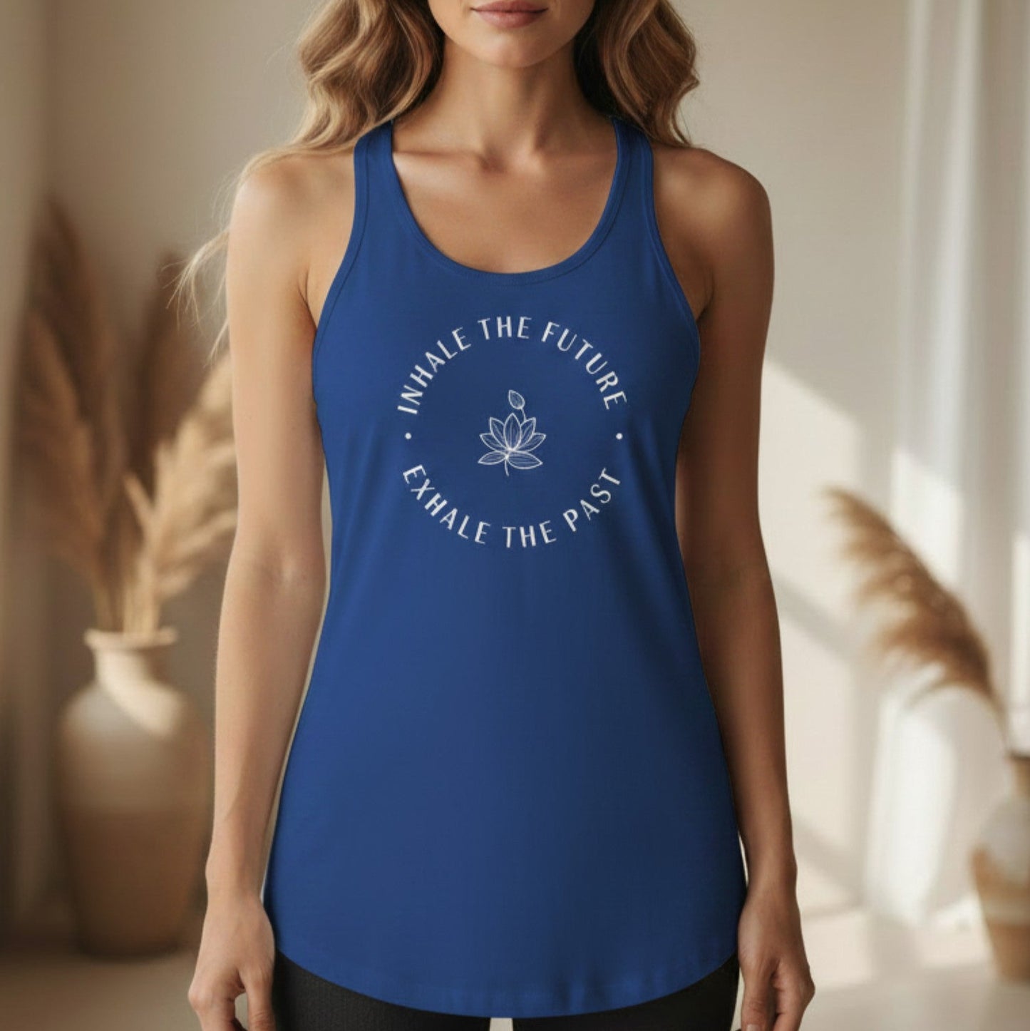 Royal blue Inhale the Future Exhale the Past racerback tank with white lotus badge design — vibrant mindfulness yoga tank for the woman who exhales the past and flows forward with intention