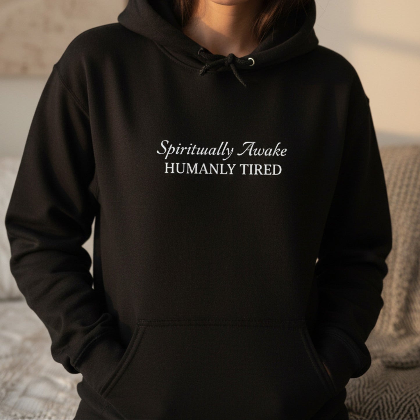 Black Spiritually Awake Humanly Tired hoodie with white typography — bold funny gift for the empath who has done the shadow work and is deeply, completely, unapologetically exhausted