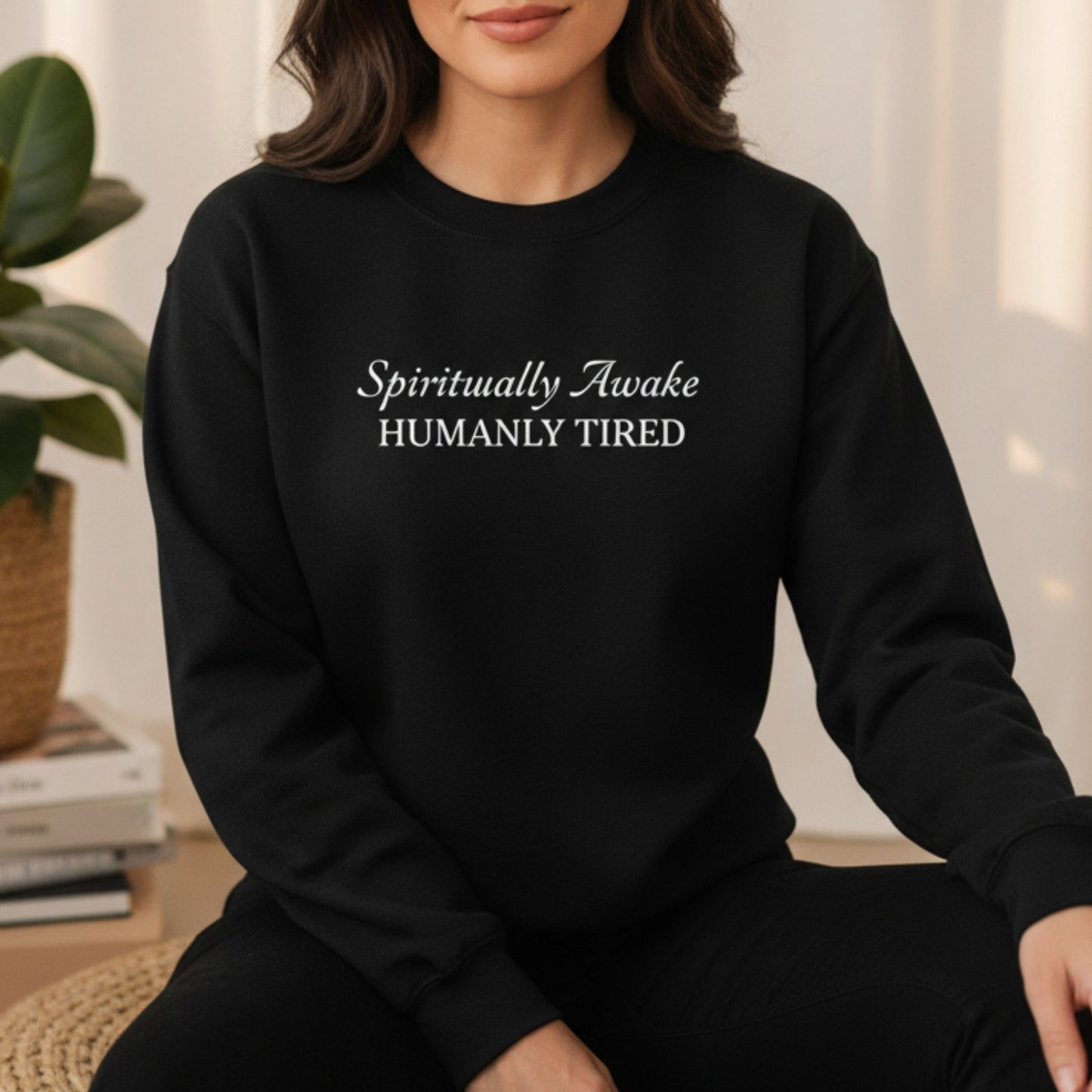 Black Spiritually Awake Humanly Tired crewneck sweatshirt with white script and caps print — bold funny spiritual gift for the empath who is fully awakened and completely depleted