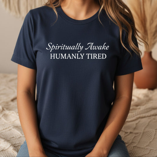 Navy Spiritually Awake Humanly Tired t-shirt with white script and serif print — funny spiritual gift for the woman who is fully aligned and absolutely running on fumes