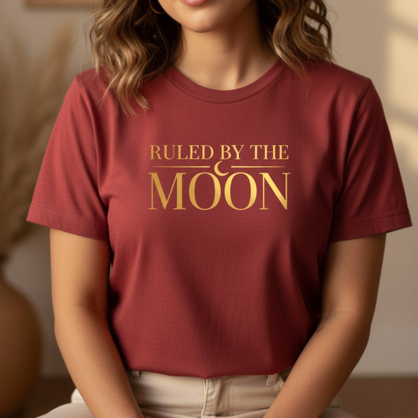 Cardinal red celestial tee with gold moon design — bold lunar energy shirt for the woman who wears her magic unapologetically