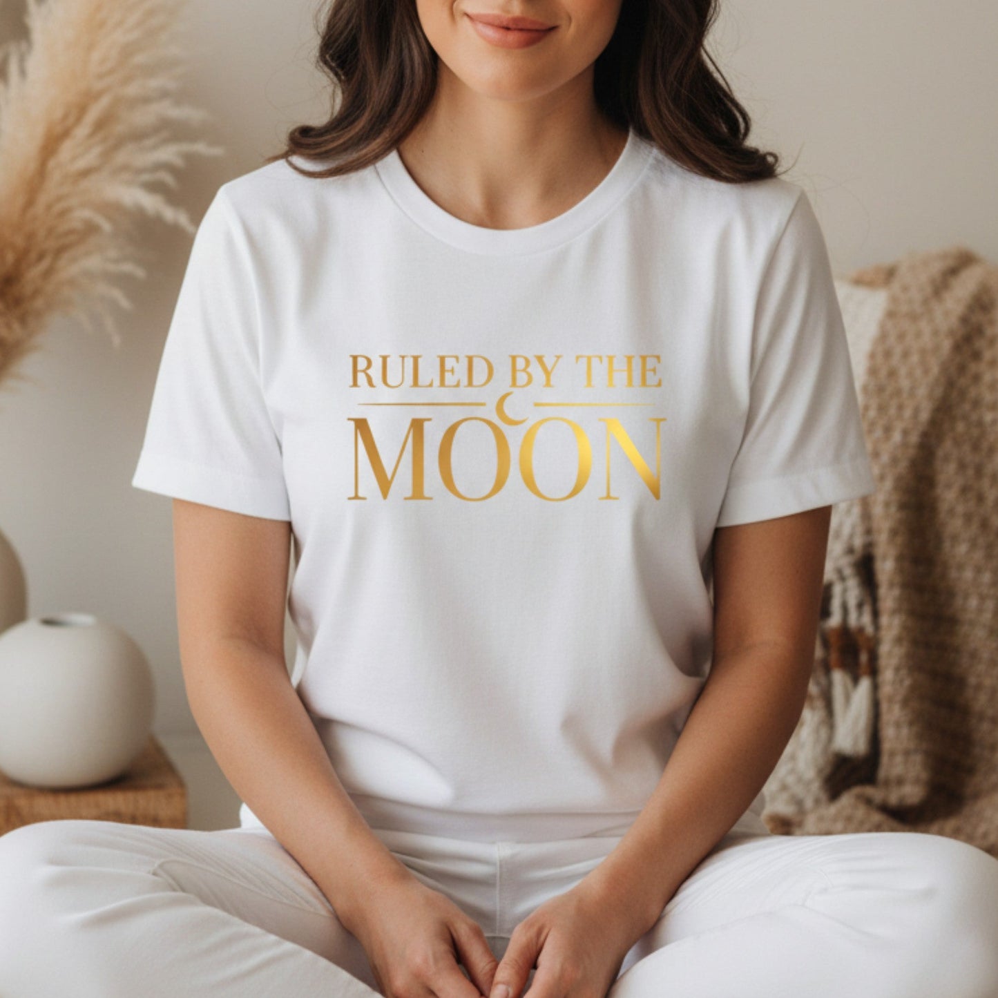 White ruled by the moon graphic tee with gold print — clean celestial shirt perfect for layering, gifting, and everyday lunar living