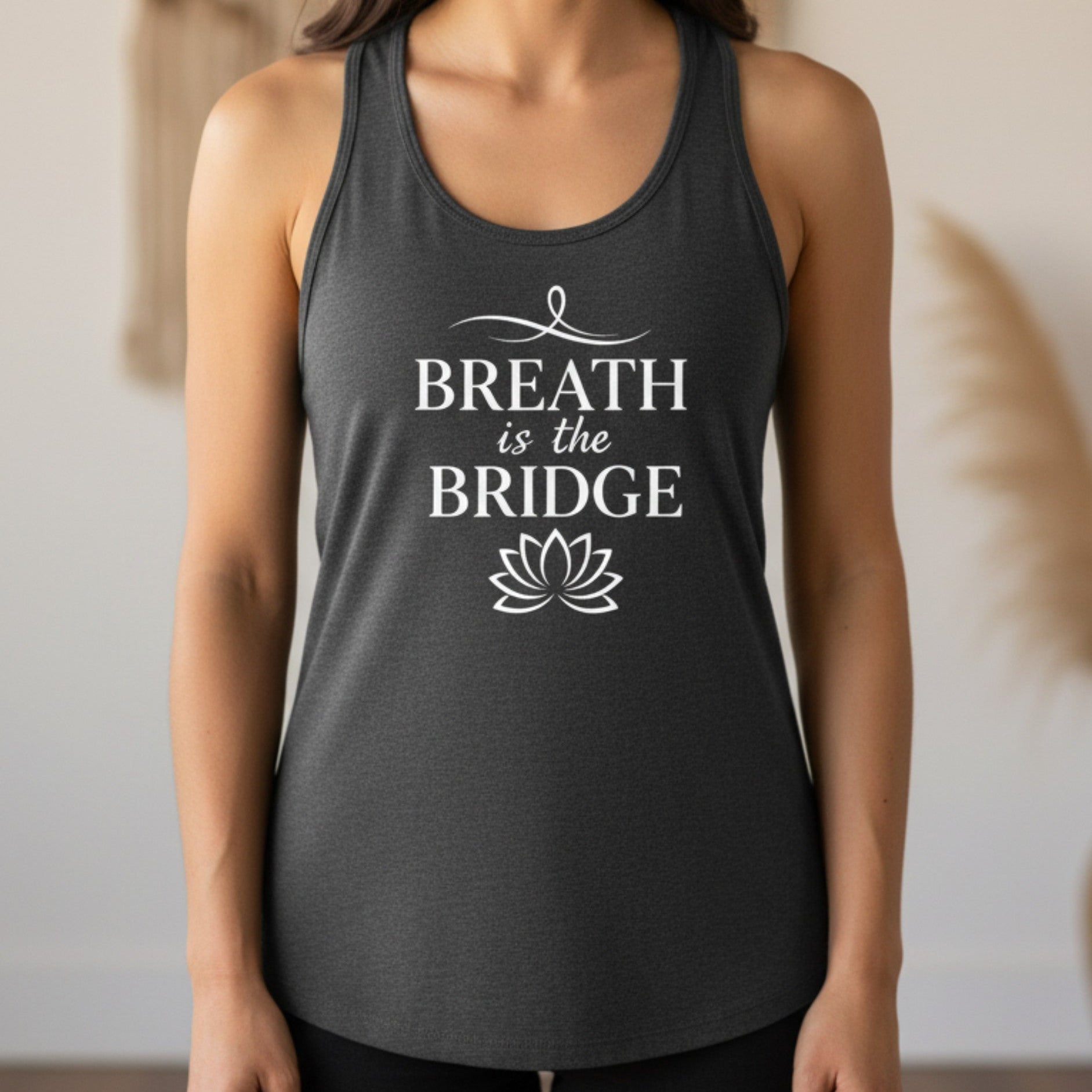 Dark gray Inhale the Future Exhale the Past racerback tank with white lotus badge print — mindfulness yoga gift for the woman who breathes forward and releases what no longer serves her