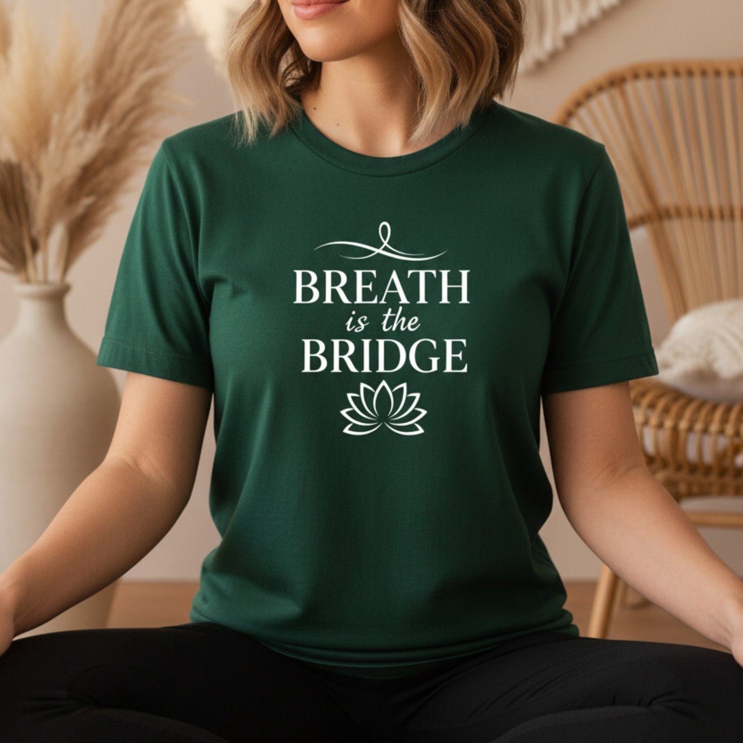 Forest green Breath Is The Bridge t-shirt with white typography and lotus print — earthy boho yoga gift for the spiritual woman who finds her center in the stillness between breaths