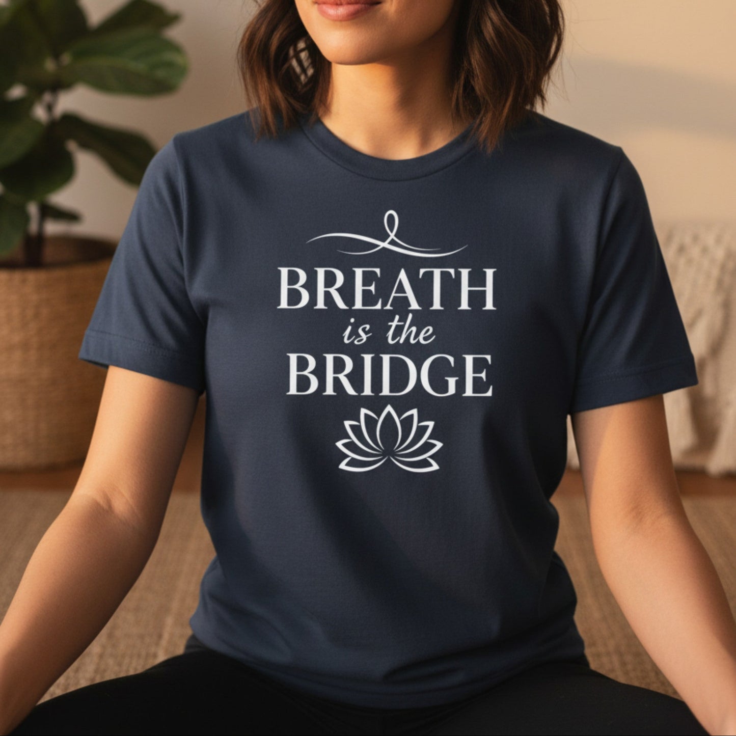 Navy Breath Is The Bridge t-shirt with white serif caps and lotus print — mindfulness yoga gift for the woman who finds her way back to herself one breath at a time