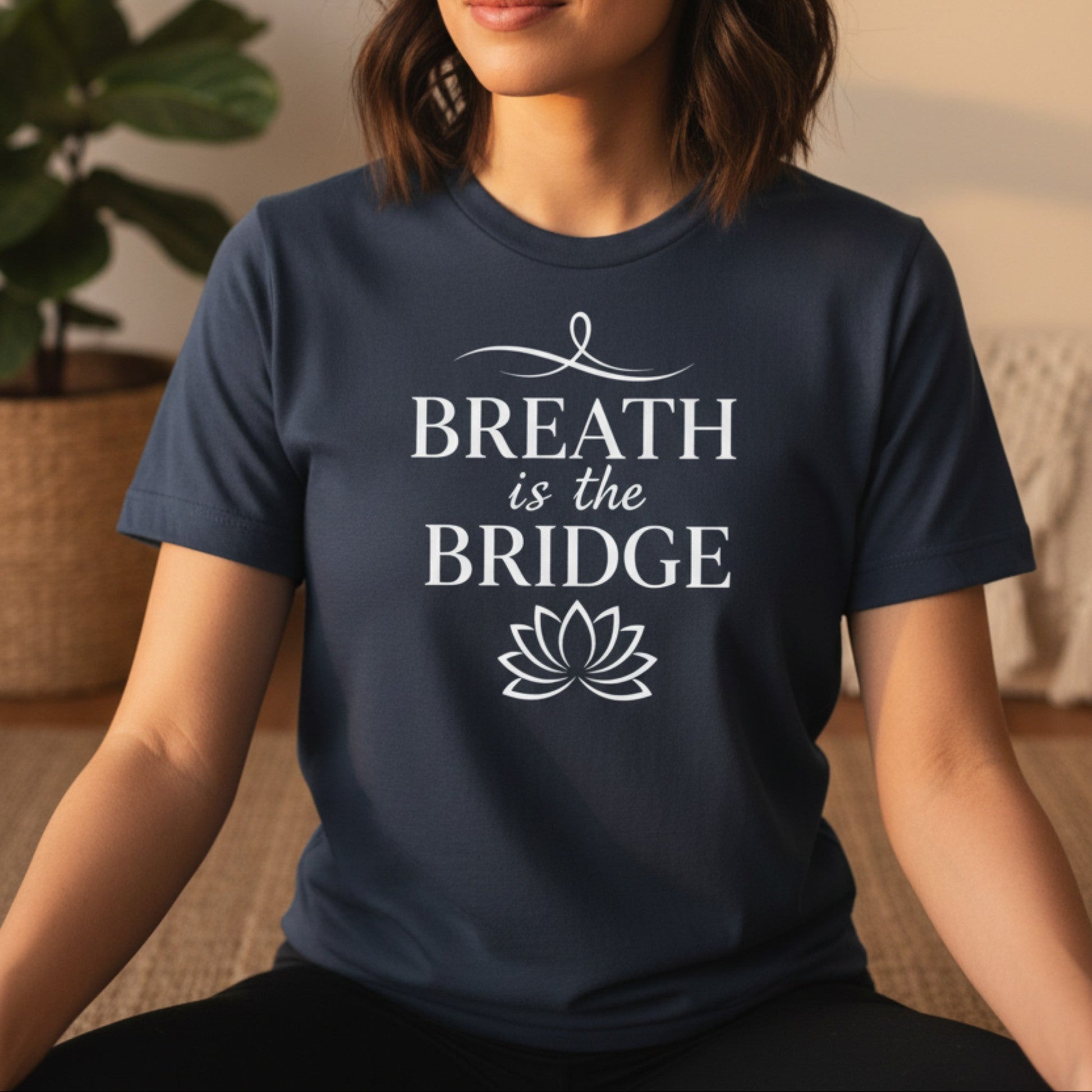 Navy Breath Is The Bridge t-shirt with white serif caps and lotus print — mindfulness yoga gift for the woman who finds her way back to herself one breath at a time