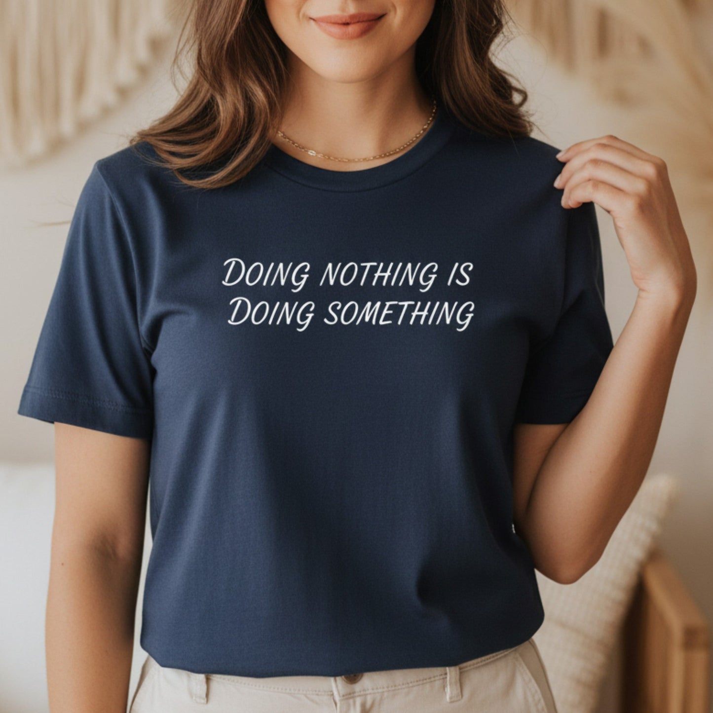Navy blue women's t-shirt with Doing Nothing Is Doing Something — intentional living apparel, unisex relaxed fit, sizes S–XL