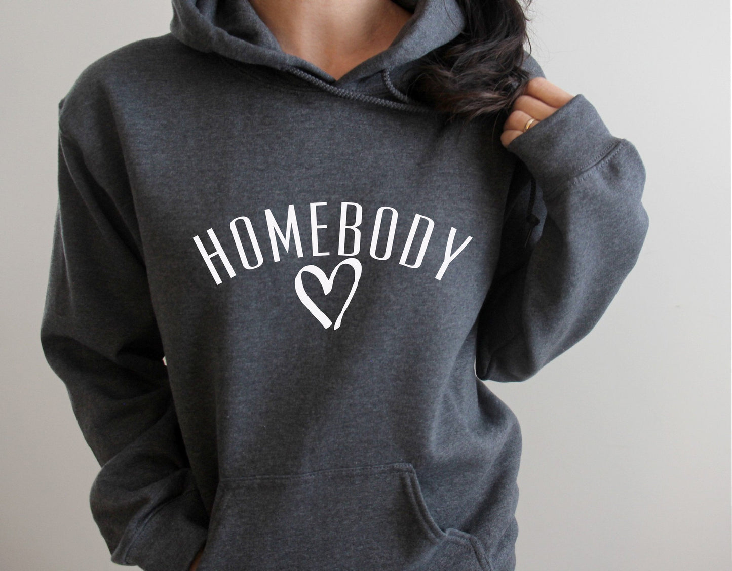 Women's funny introvert pullover hoodie with bold "Homebody" graphic print in grey