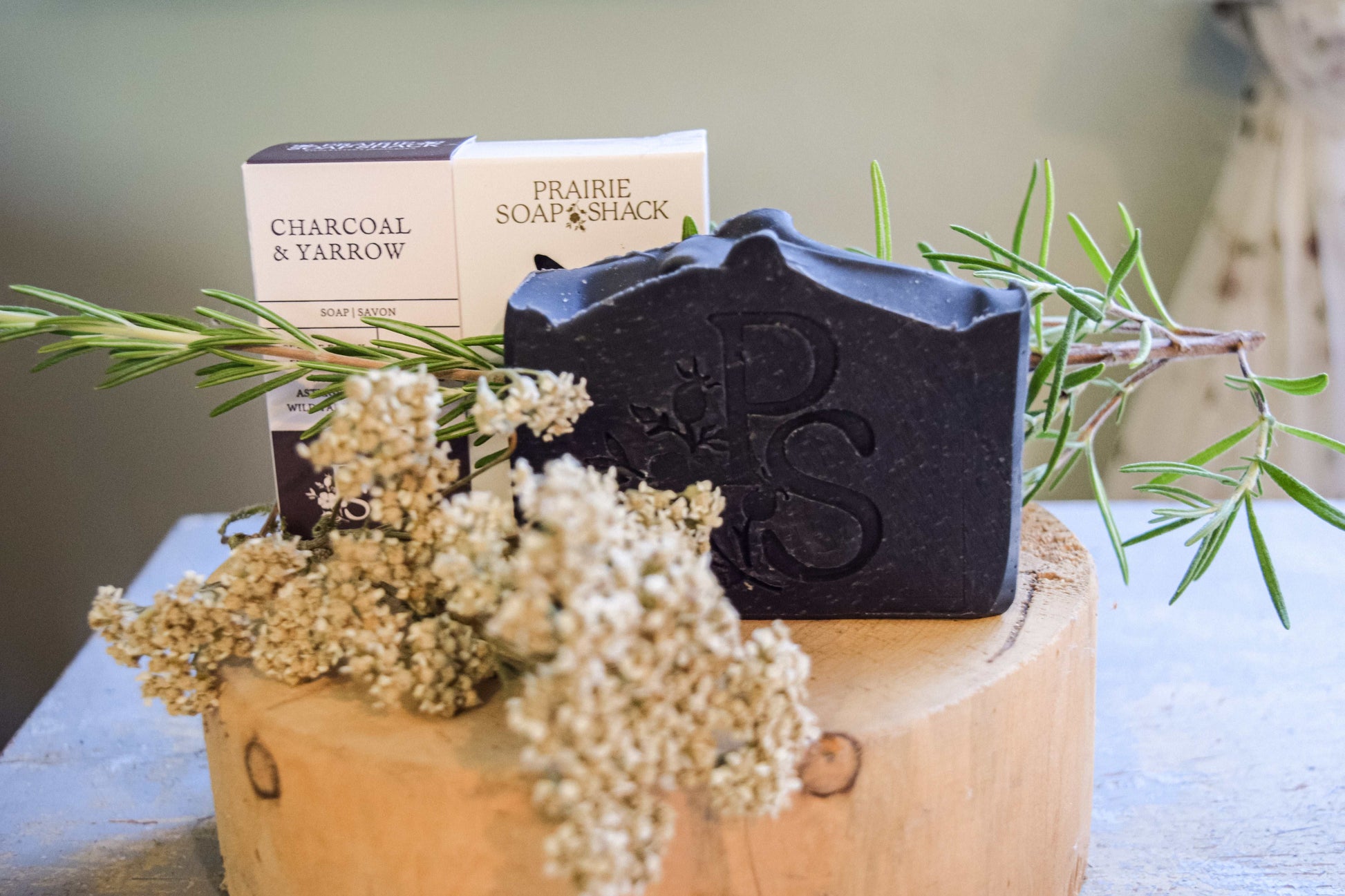 Natural activated charcoal artisan soap close-up showing handcrafted detail