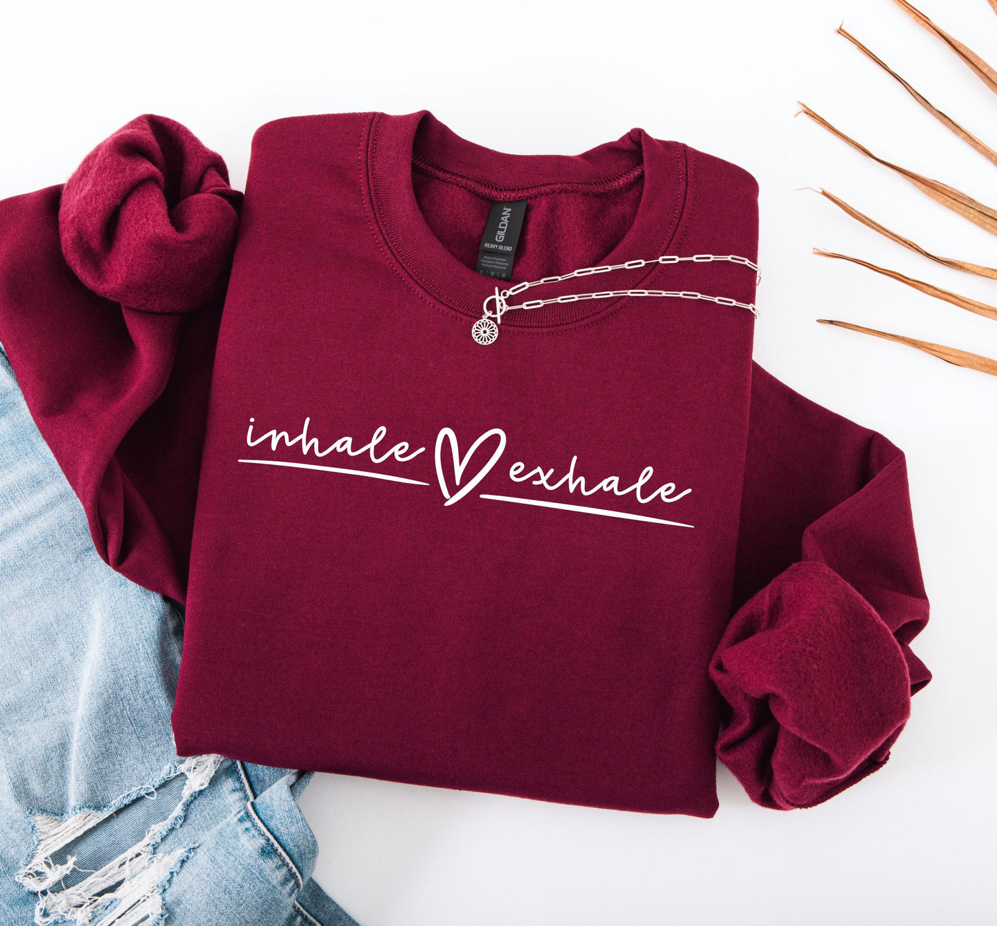 Women's mindfulness sweatshirt with peaceful "Inhale Exhale" graphic print in maroon