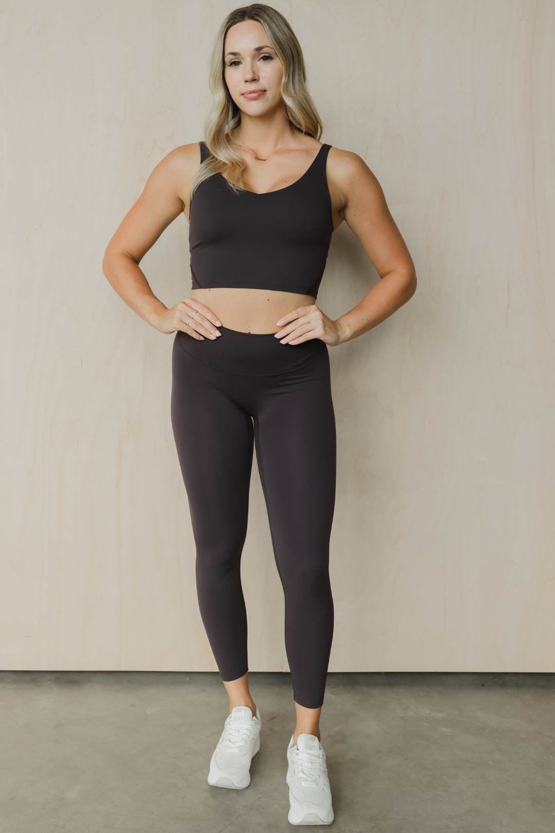 front view of a woman wearing 25 inch barely there leggings in steel grey for loungewear and athletic wear
