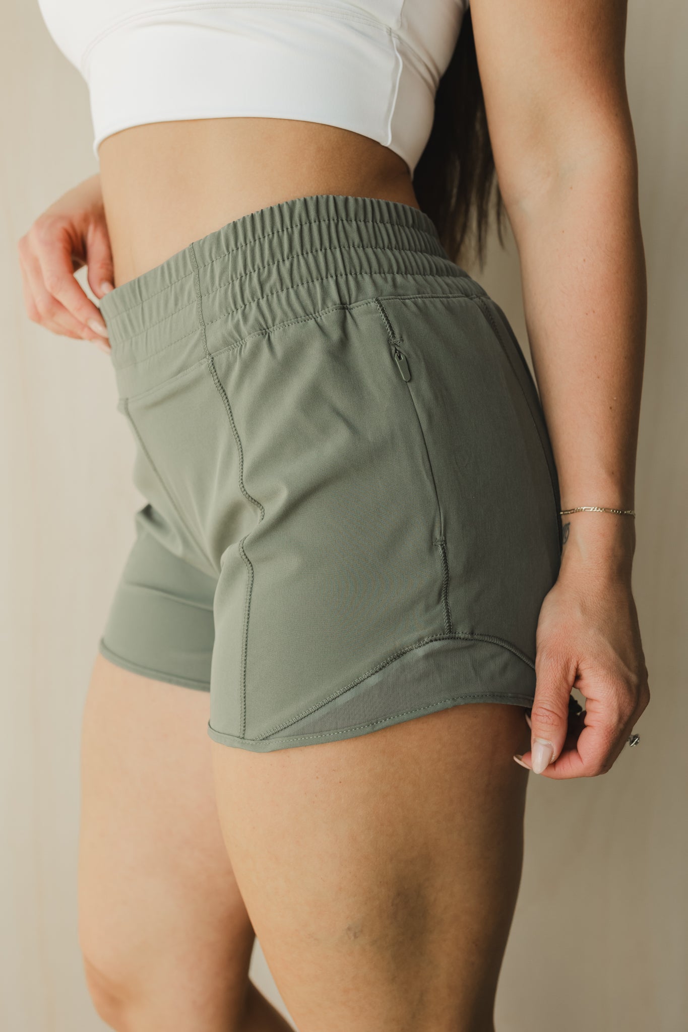 side view of woman wearing Ready for It shorts in sage for workouts and casual wear