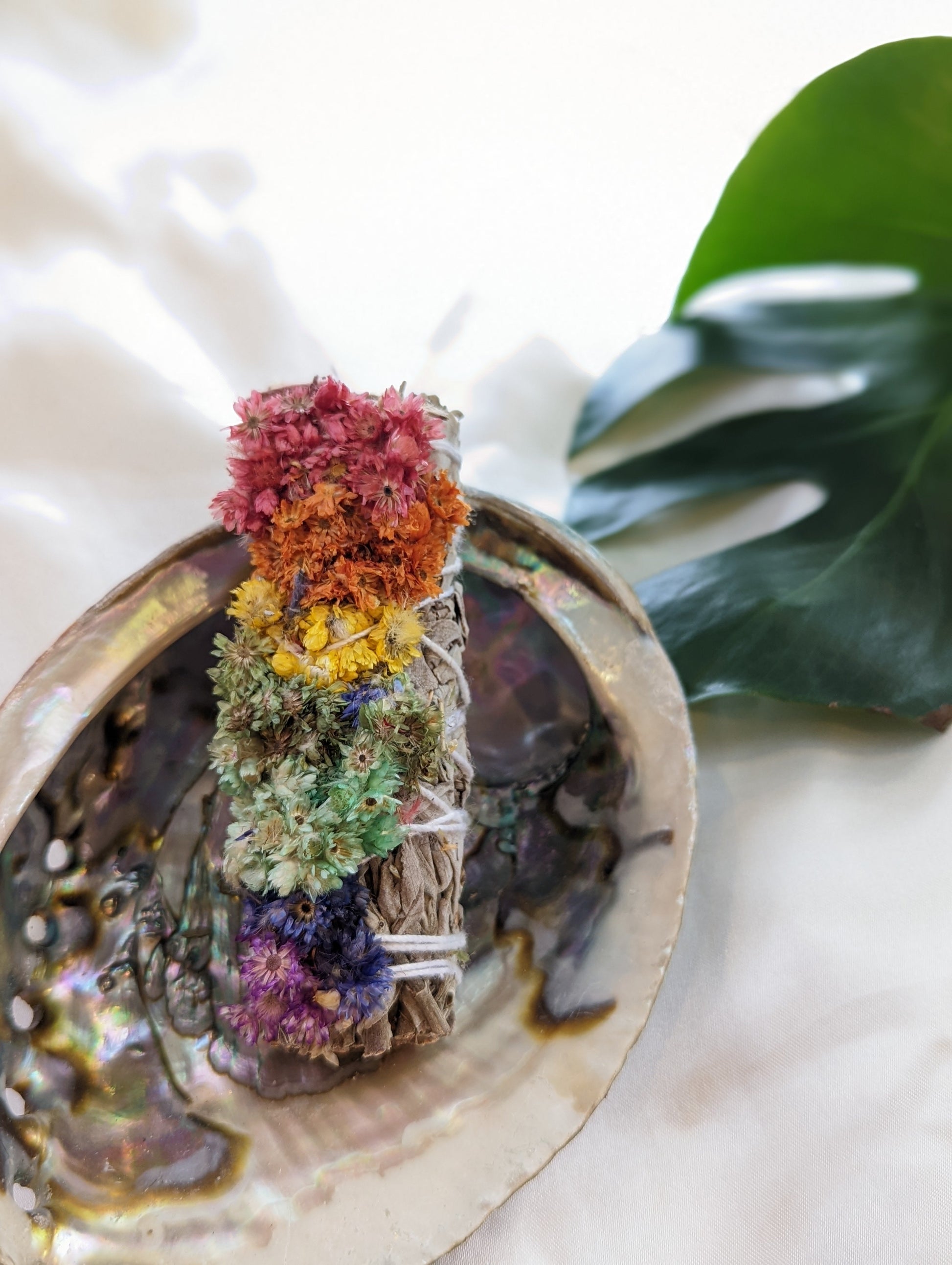4 inch 7 chakra white sage bundle with colourful flowers for energy clearing rituals
