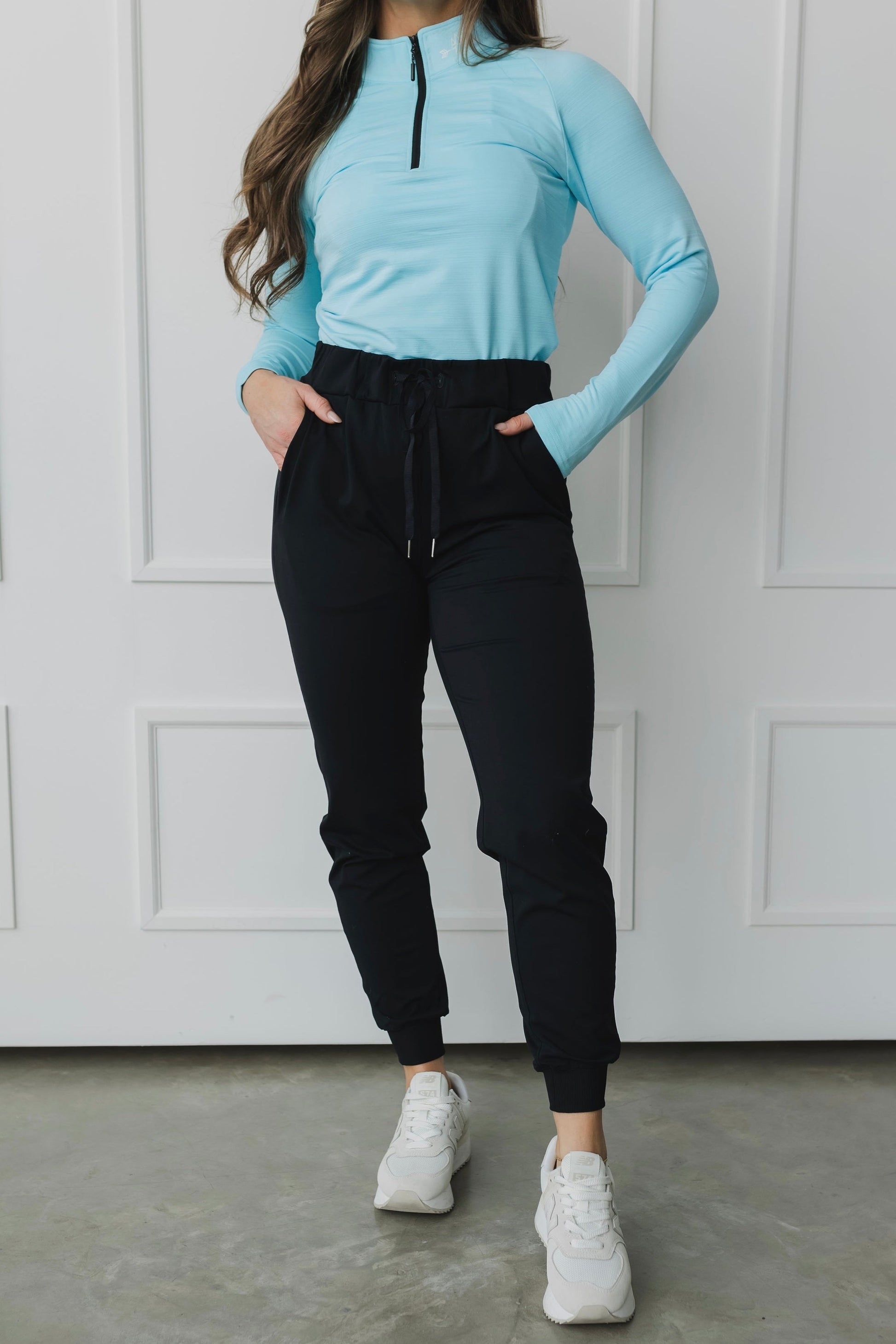 full front view of a woman wearing cuffed ankle jogger in black for loungewear and casual athleisure 