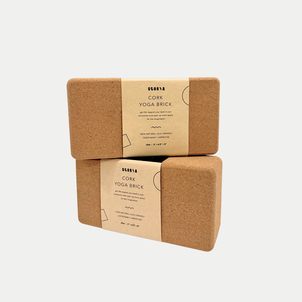 Two slim Cork Yoga Block 3x4.5x8.5 inches stacked on top of each other in packaging