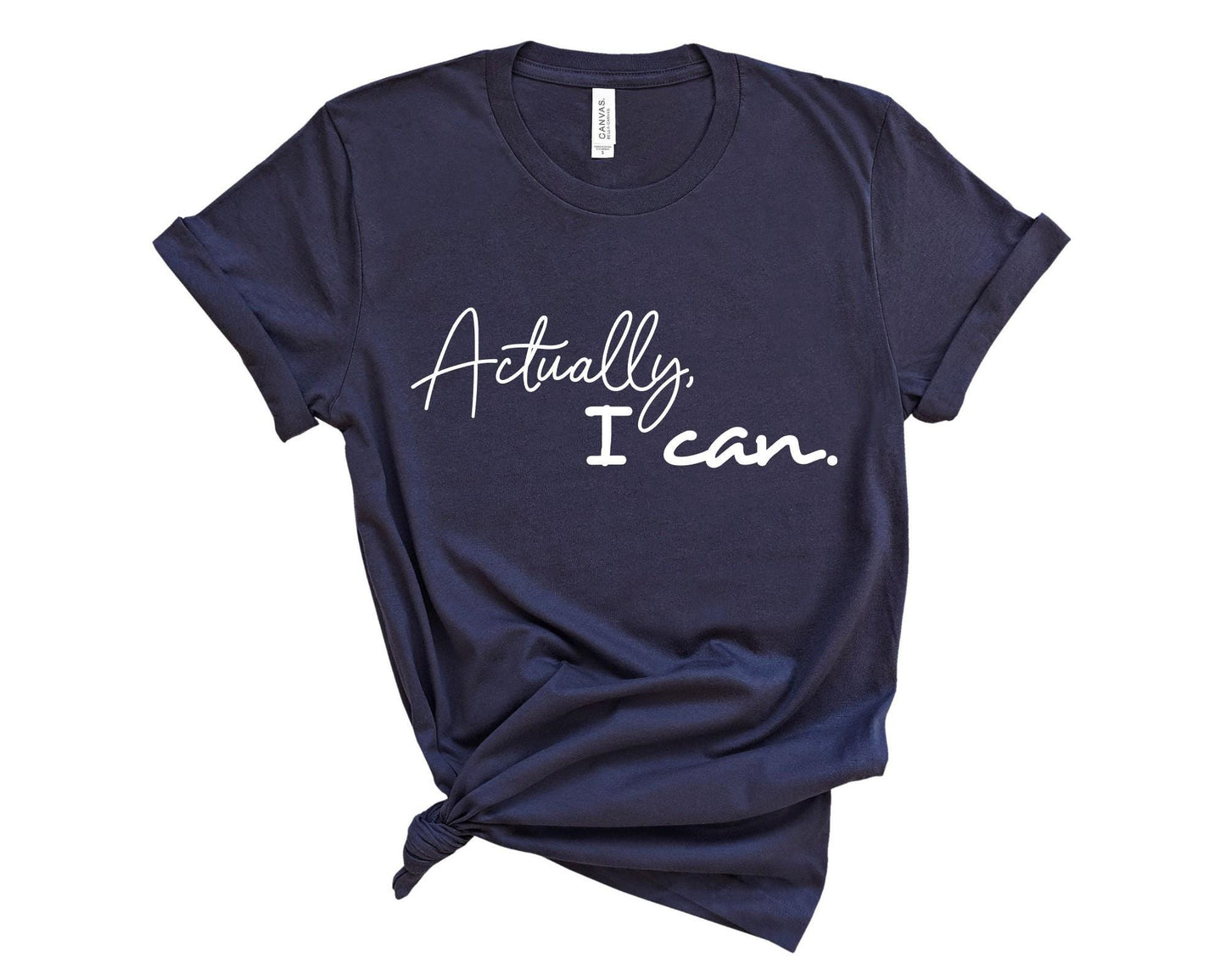 Women's empowerment t-shirt with bold "Actually I Can" affirmation graphic print in navy