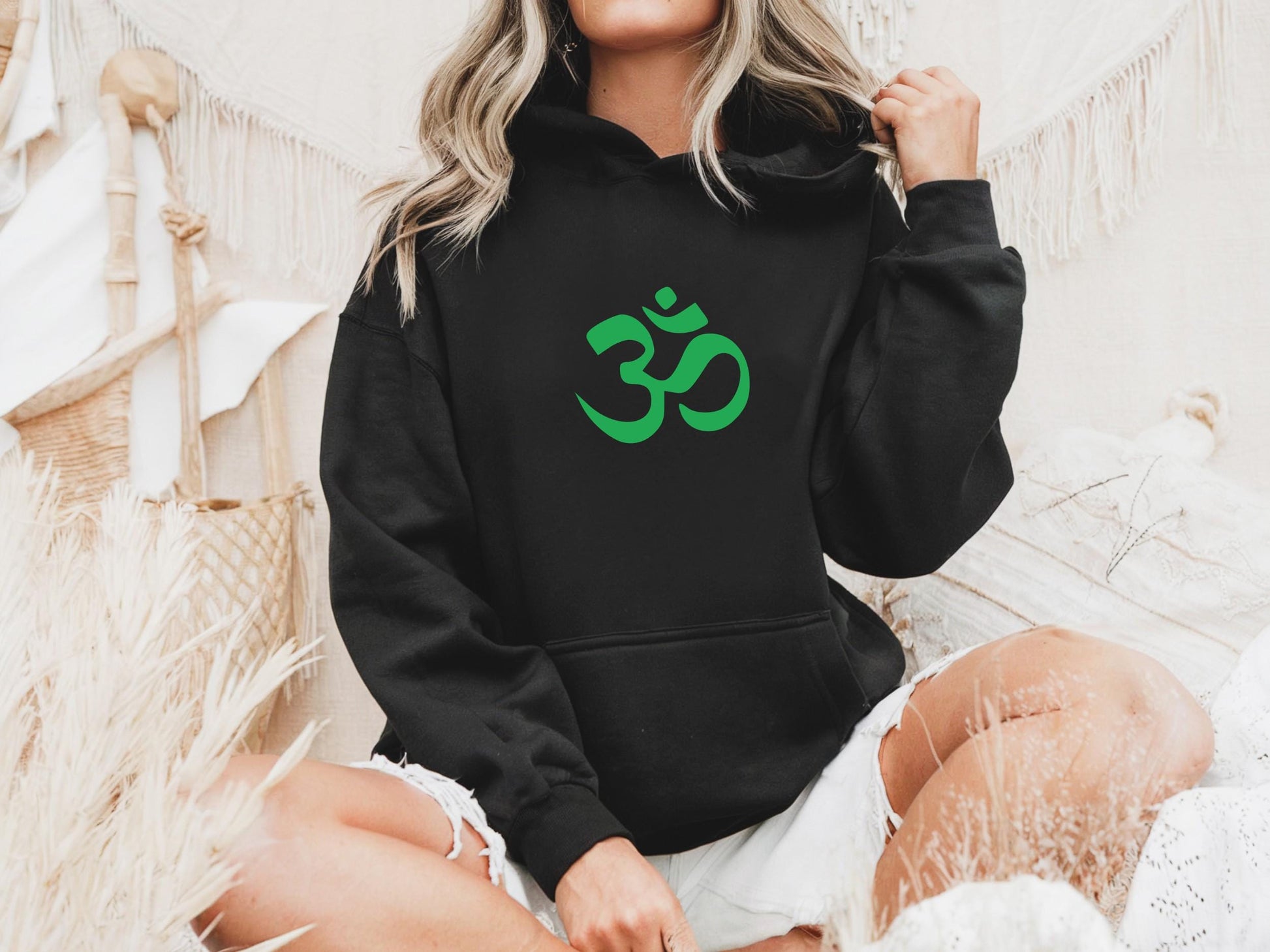 Spiritual Om symbol hoodie for devoted yoga practitioners and mindful women in black with green om