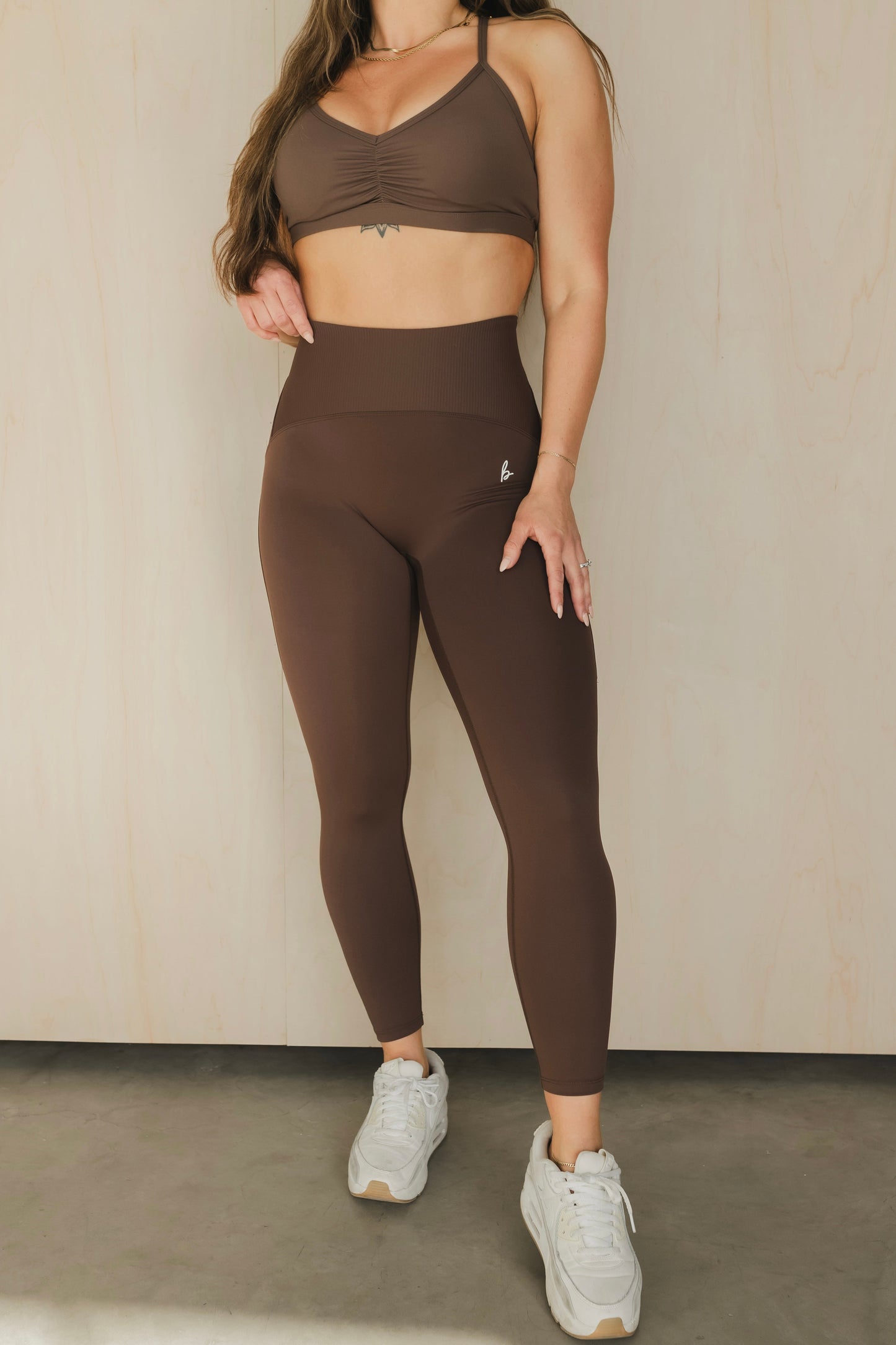 full body view of a woman wearing 25 inch elevation leggings in french press for yoga and studio workouts