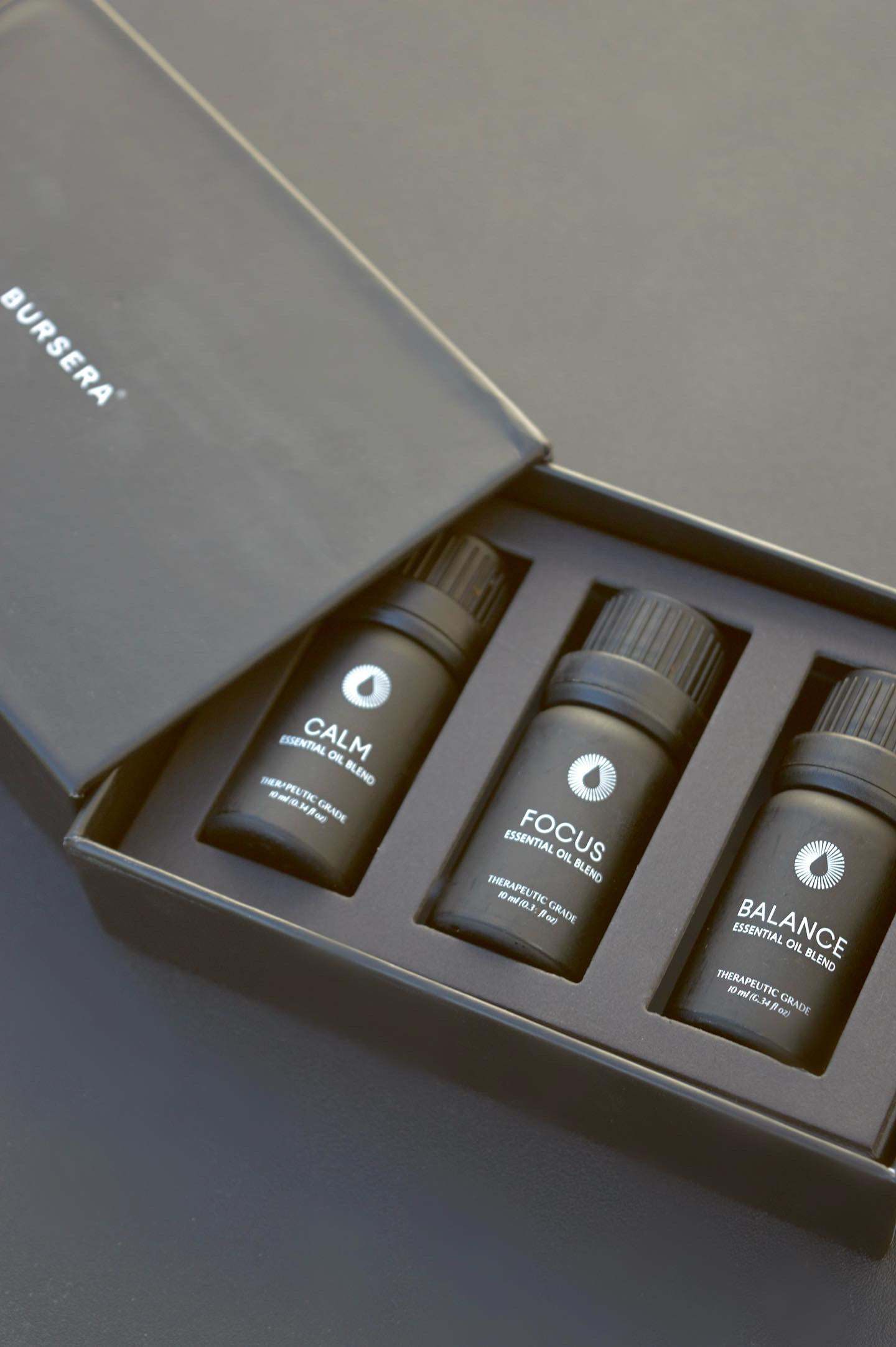 Set of three small bottles labeled 'Calm', 'Focus', and 'Balance' in a branded box.