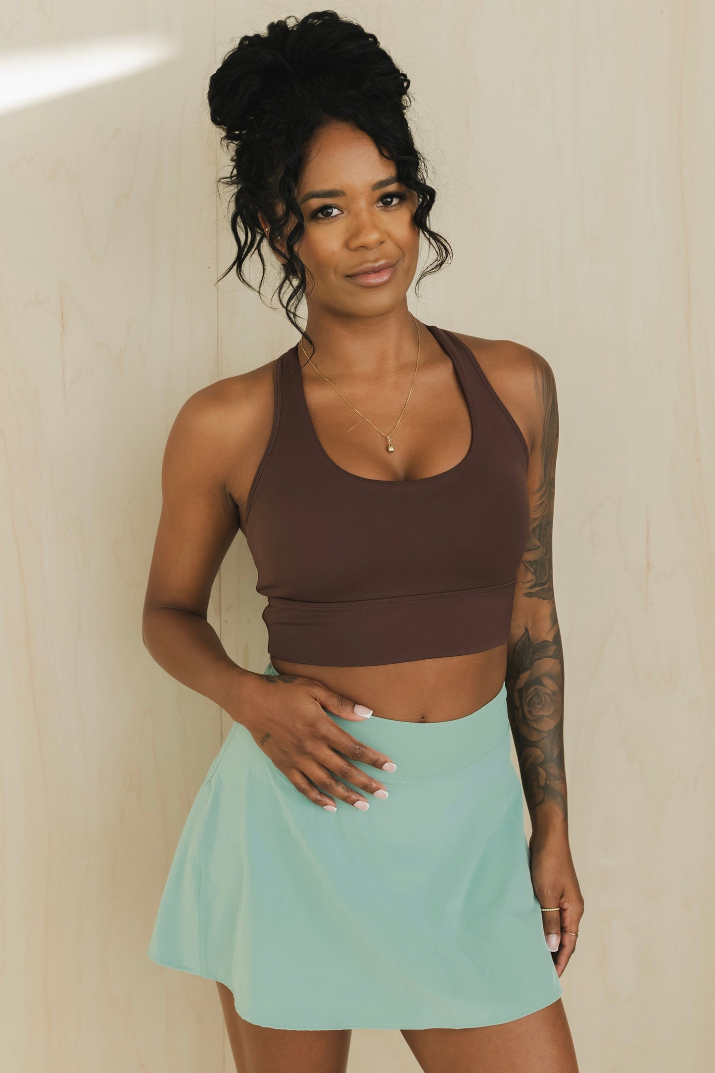 full body front view of racerback sports bra in americano brown for yoga and fitness