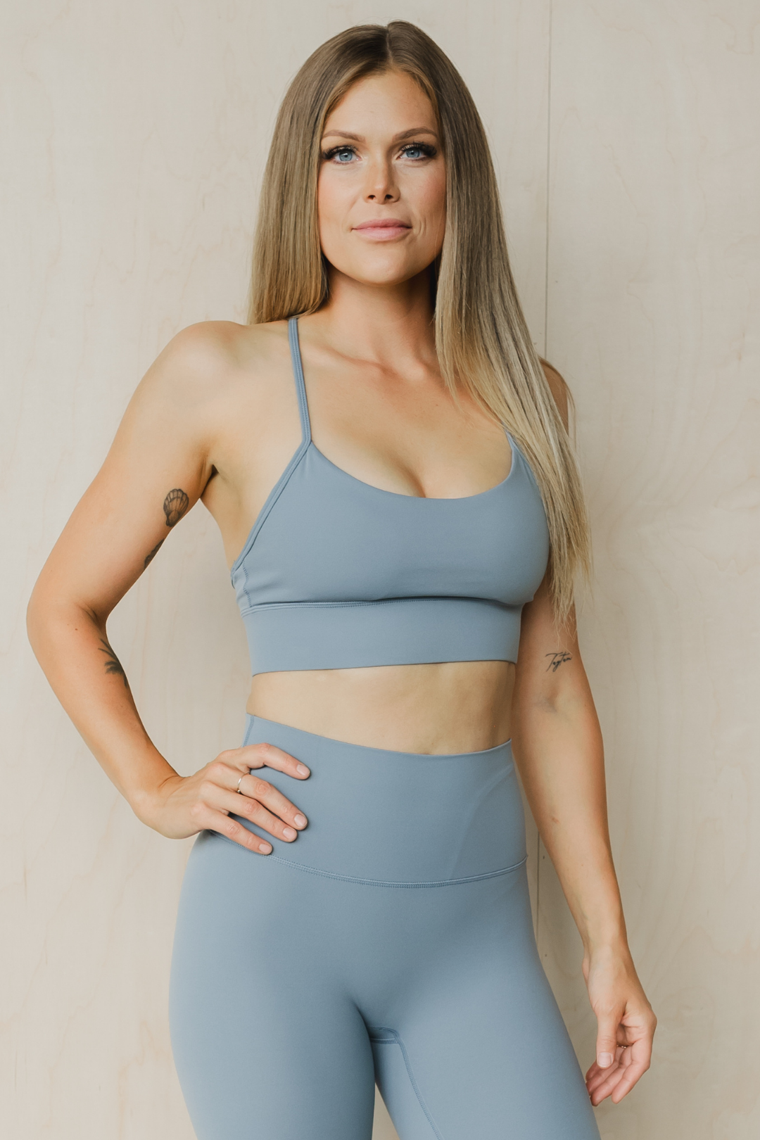 front  view of a woman wearing a barely there sports bra in dark slate grey for the gym and activewear