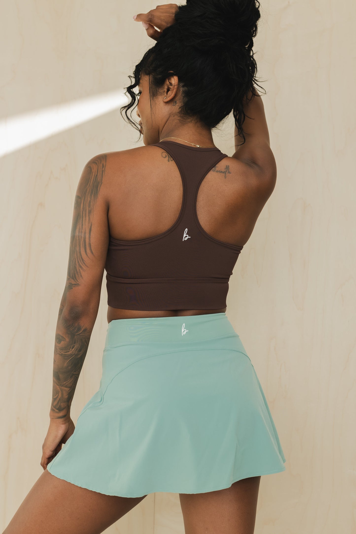 back view of racerback sports bra in americano brown for yoga and fitness