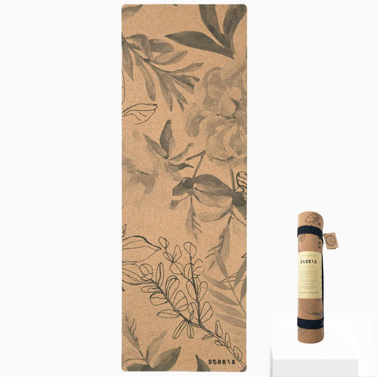 cork yoga mat with botanicals design and a rolled up mat beside it
