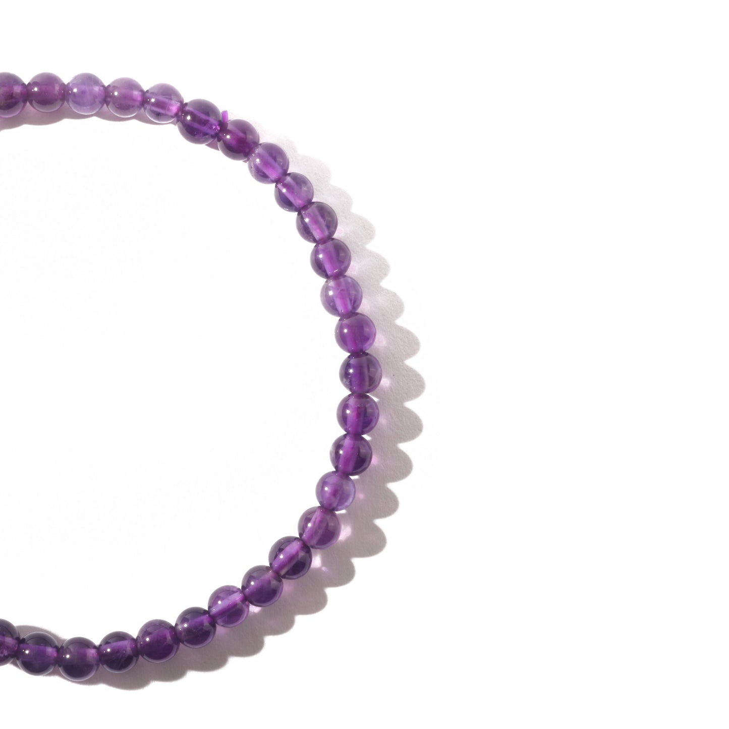 Protective amethyst crystal bracelet worn on wrist for calm energy