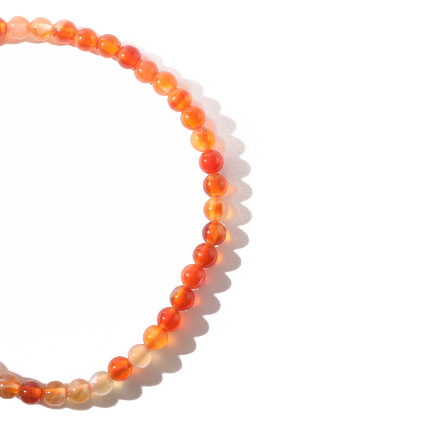 Carnelian bracelet close-up showing natural warm orange and red tones