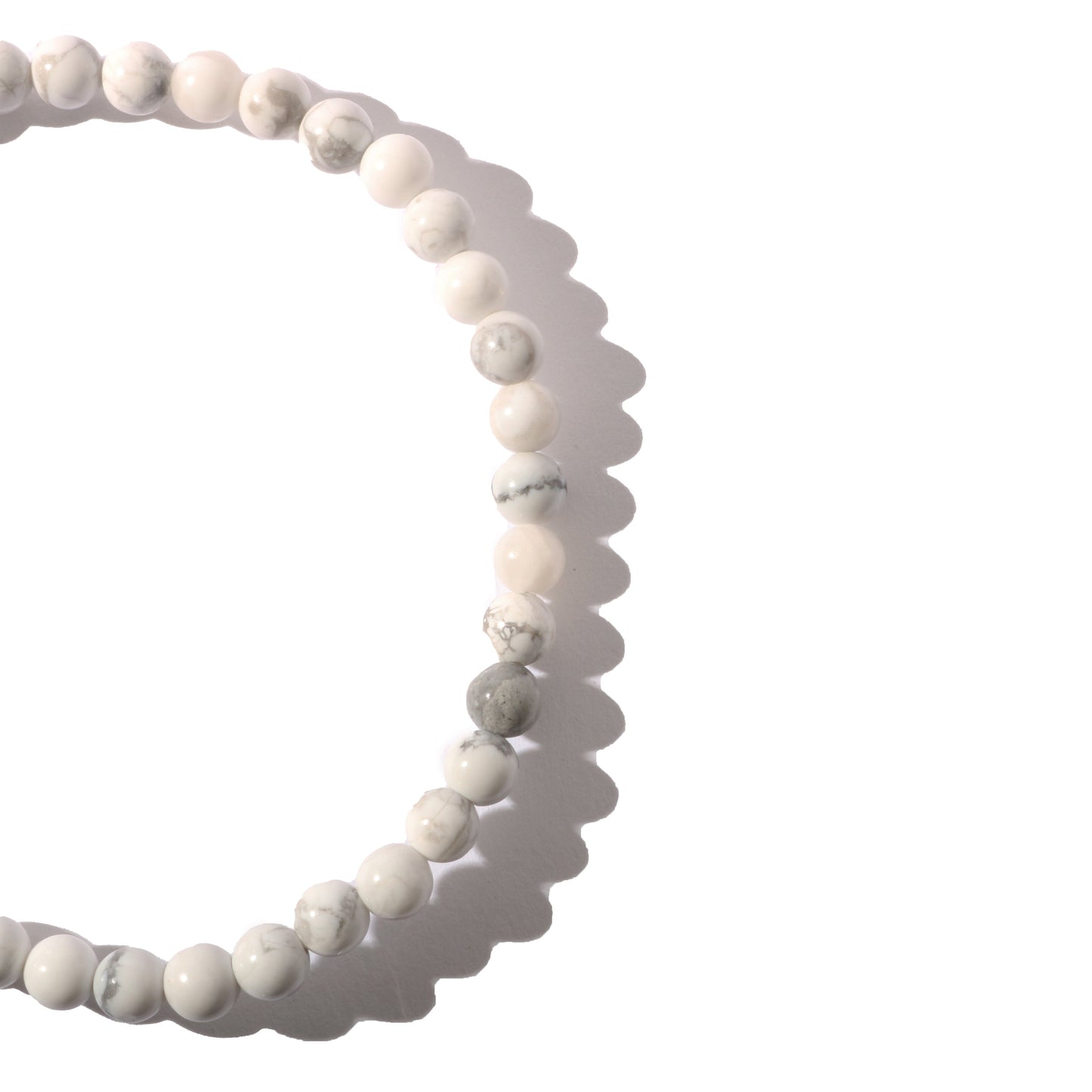 White howlite crystal bracelet worn on wrist for calming energy