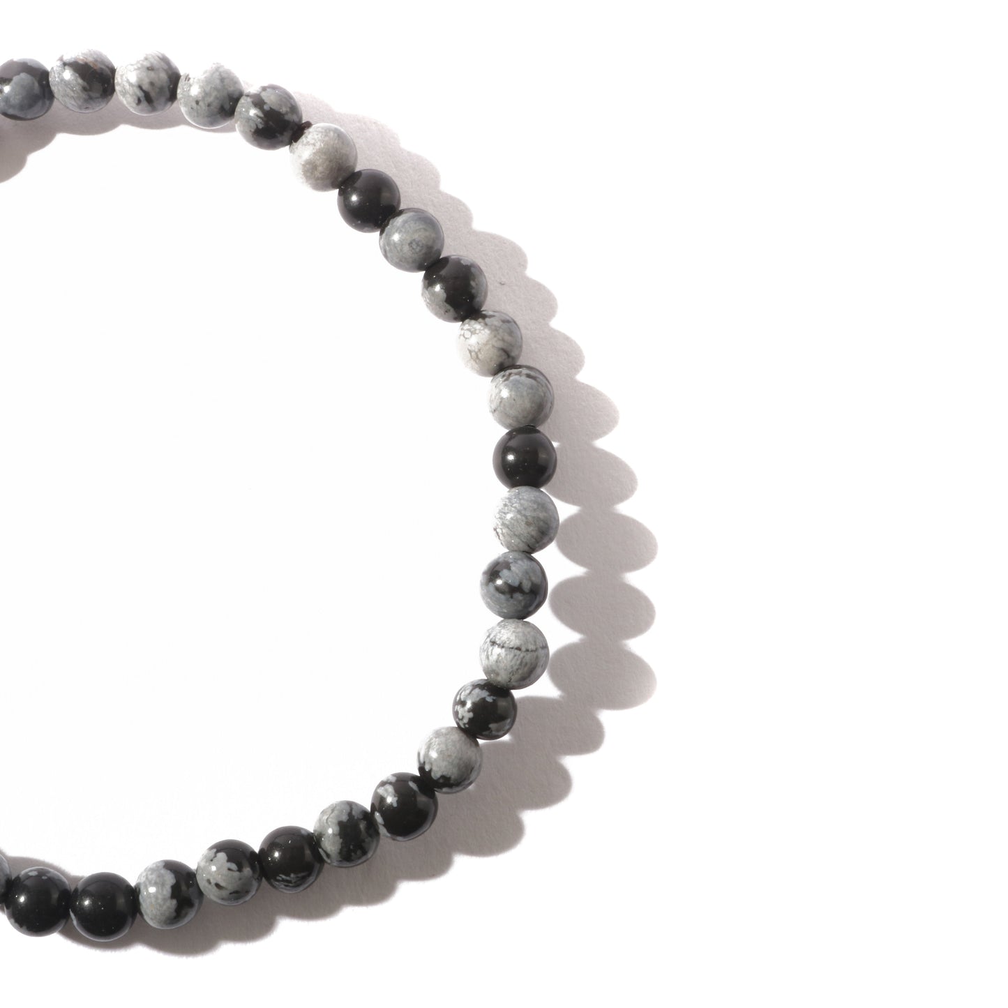 Protective obsidian bracelet worn on wrist for grounding energy