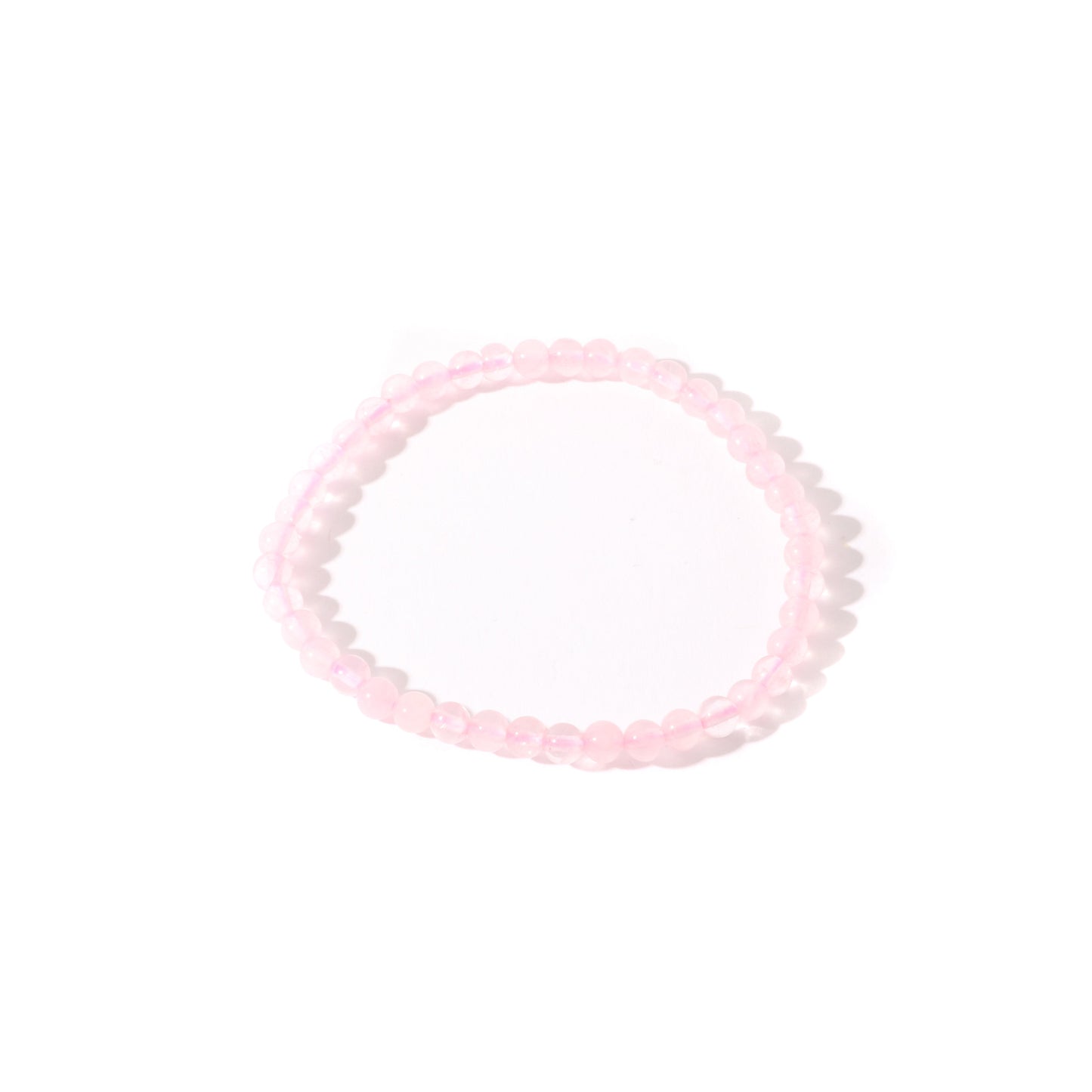 Rose quartz bead bracelet close-up showing natural soft pink crystal