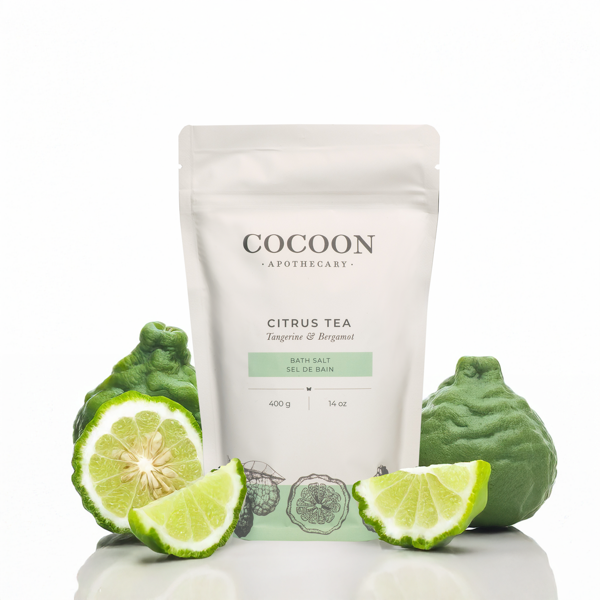 Cocoon Apothecary Citrus Tea bath salt packaging with lime slices and green fruit on a white background