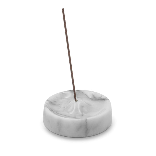white marble incense holder aromatherapy decor with a single stick on a white background