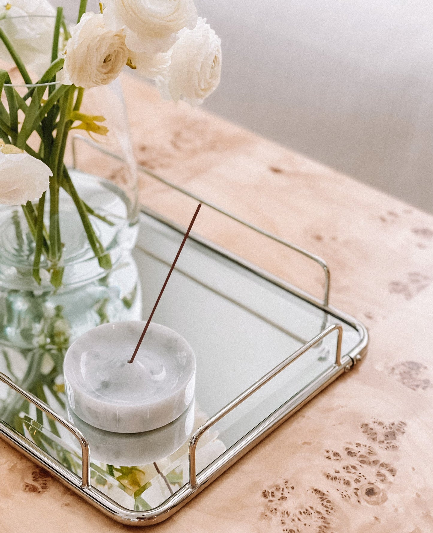 white marble incense holder aromatherapy decor with Incense stick with flowers in the background