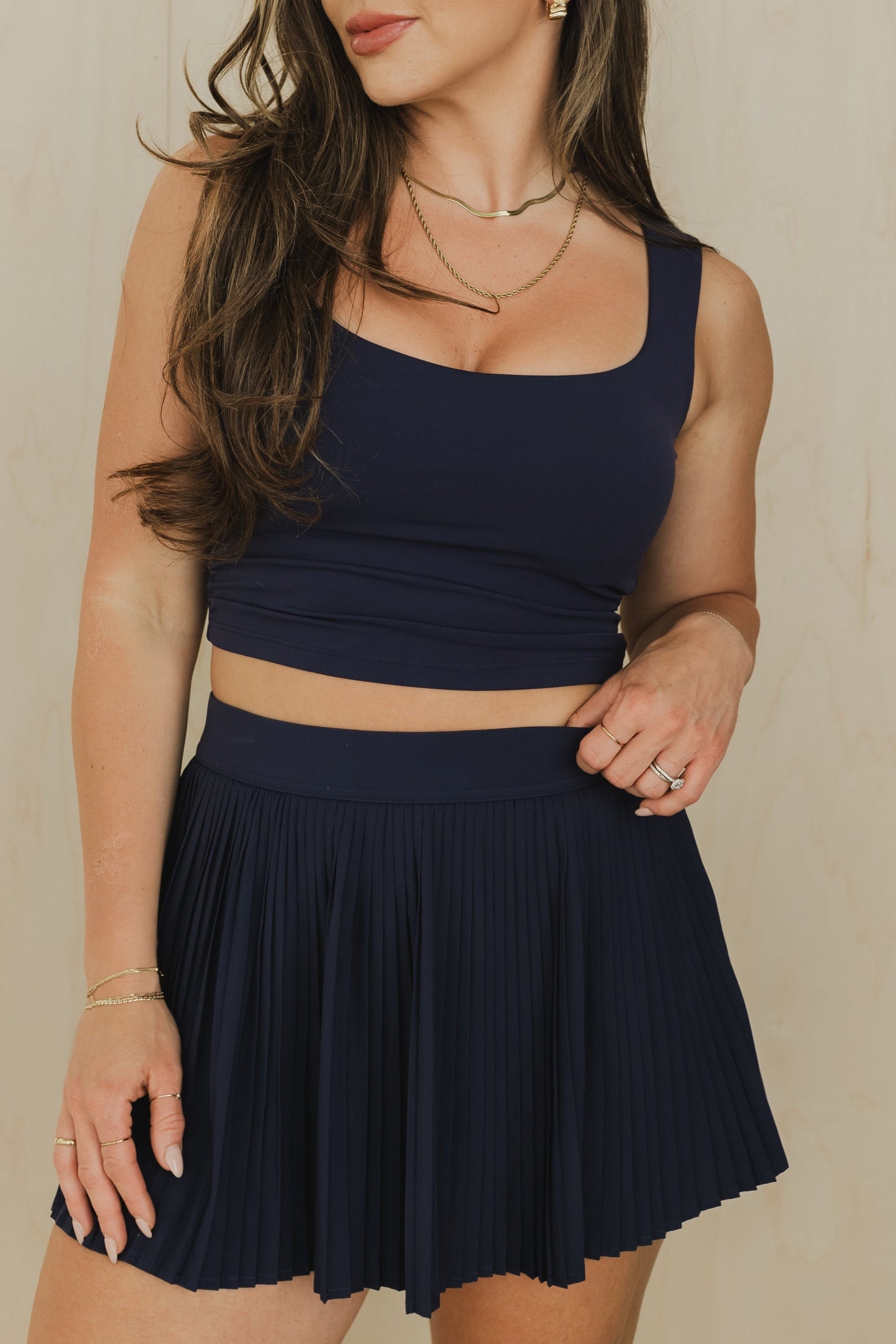 front view of a woman wearing a sweetheart tank top in midnight blue for yoga and activewear