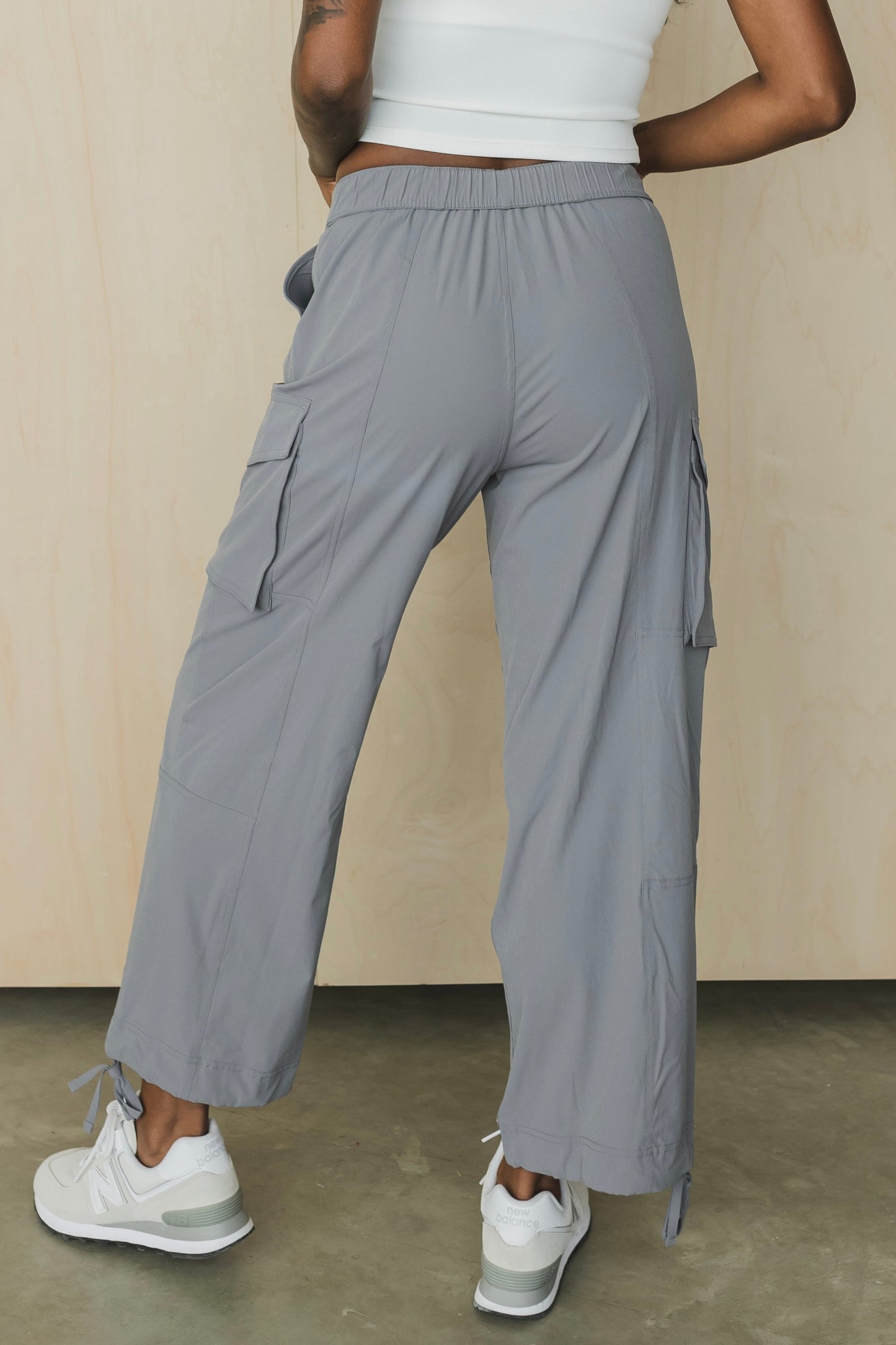 back view of a woman wearing cargo pant in grey for streetwear and casual everyday wear