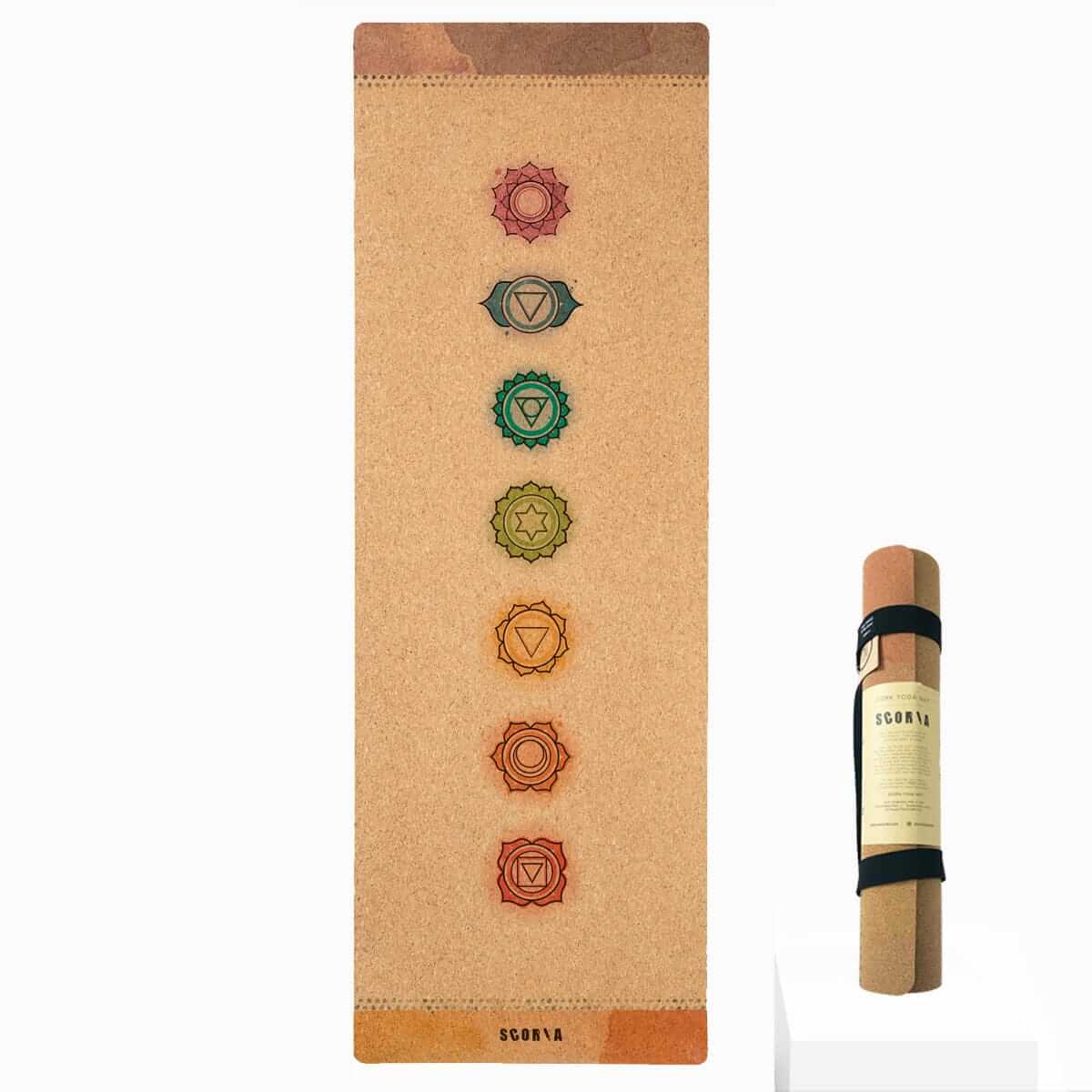 Cork yoga mat with chakra symbols and Scoria branding on a white background