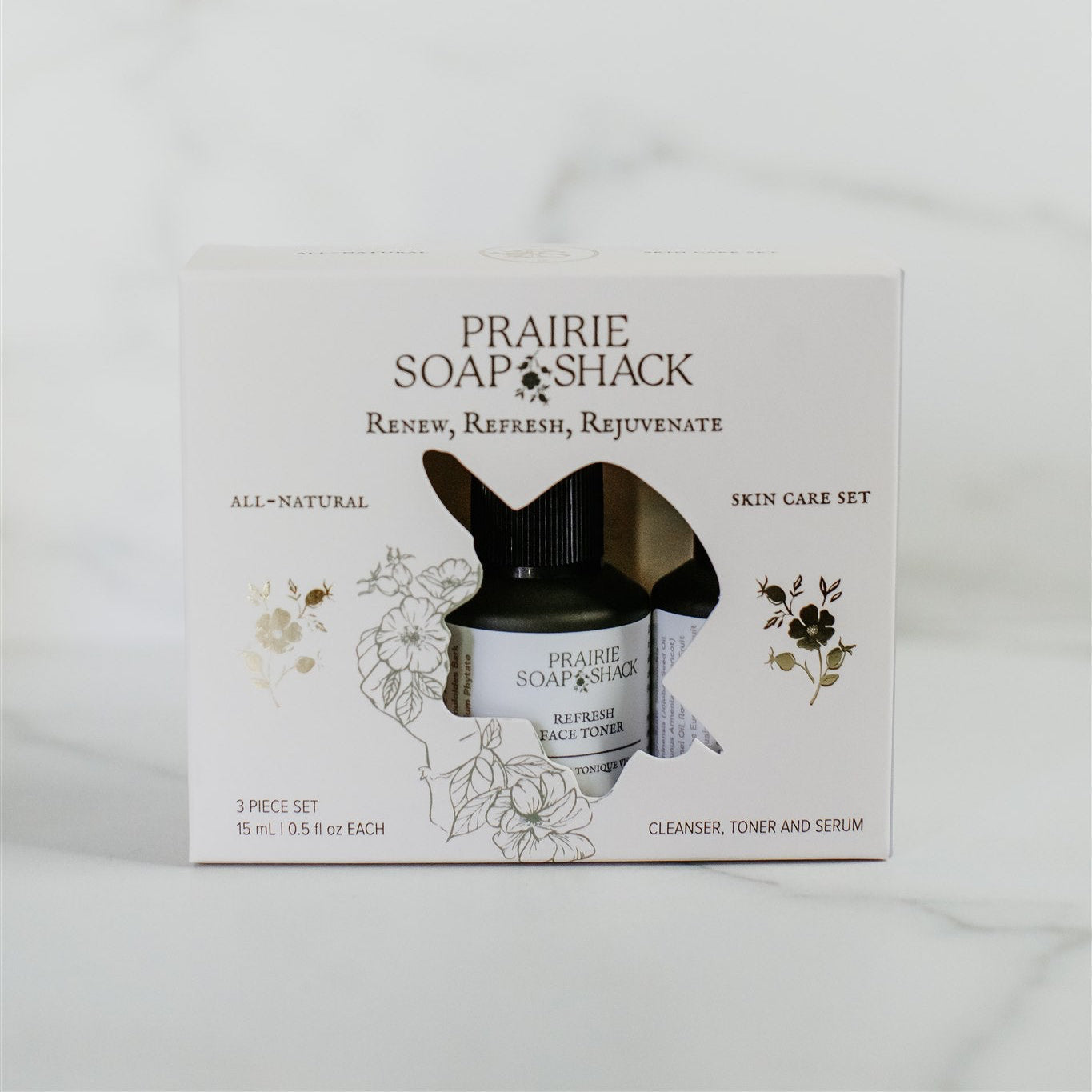 Natural botanical mini skincare trio close-up showing all three products in package