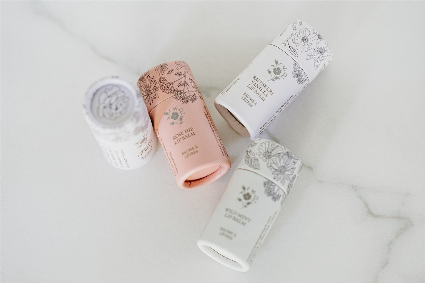 Set of lip balms on a light background
