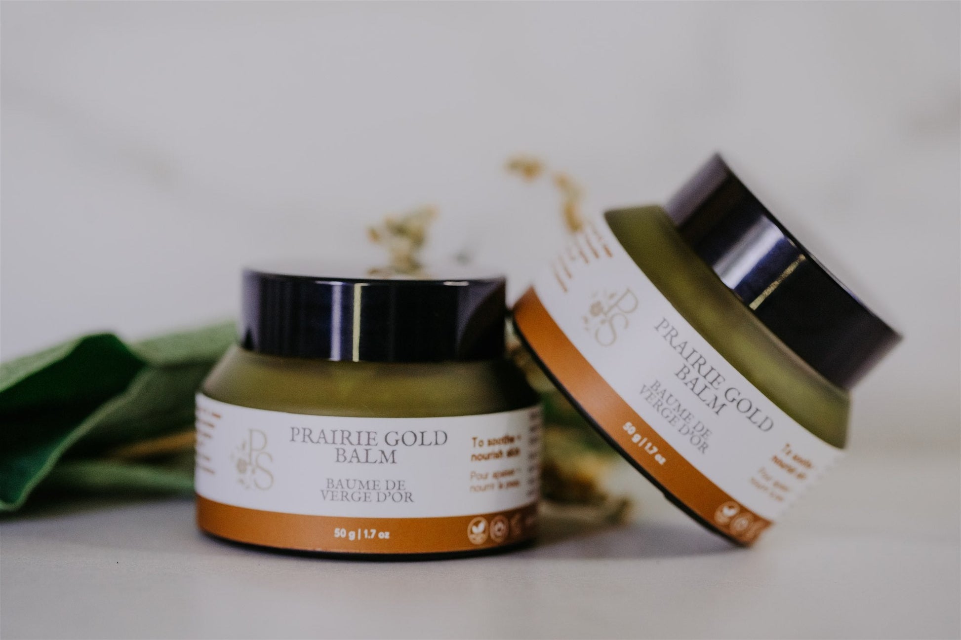 Natural Prairie Gold Balm close-up showing rich golden texture and tin detail