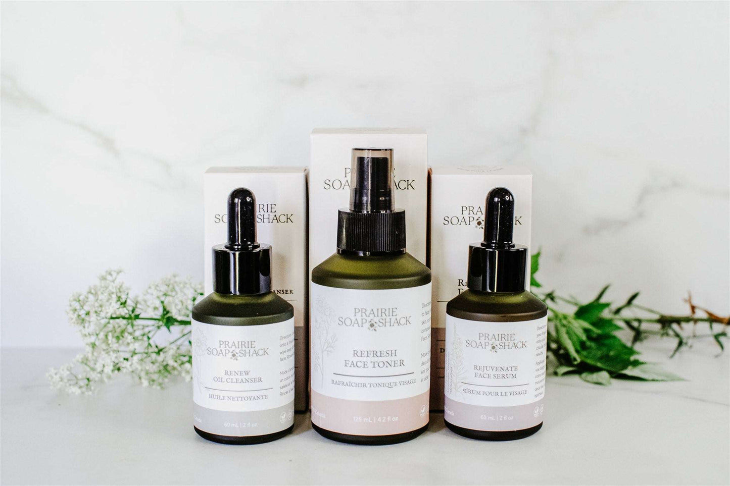 Botanical skincare set in lifestyle flat lay showing complete daily routine