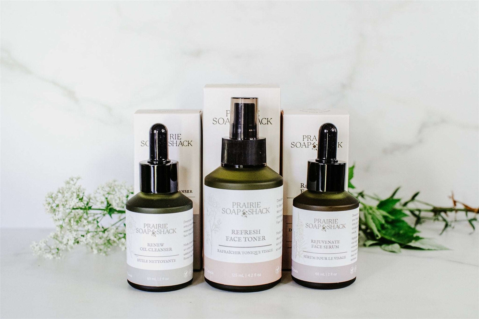 Botanical skincare set in lifestyle flat lay showing complete daily routine