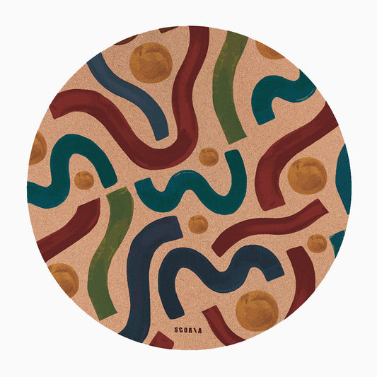 Round cork mat with colorful wavy pattern on a beige background