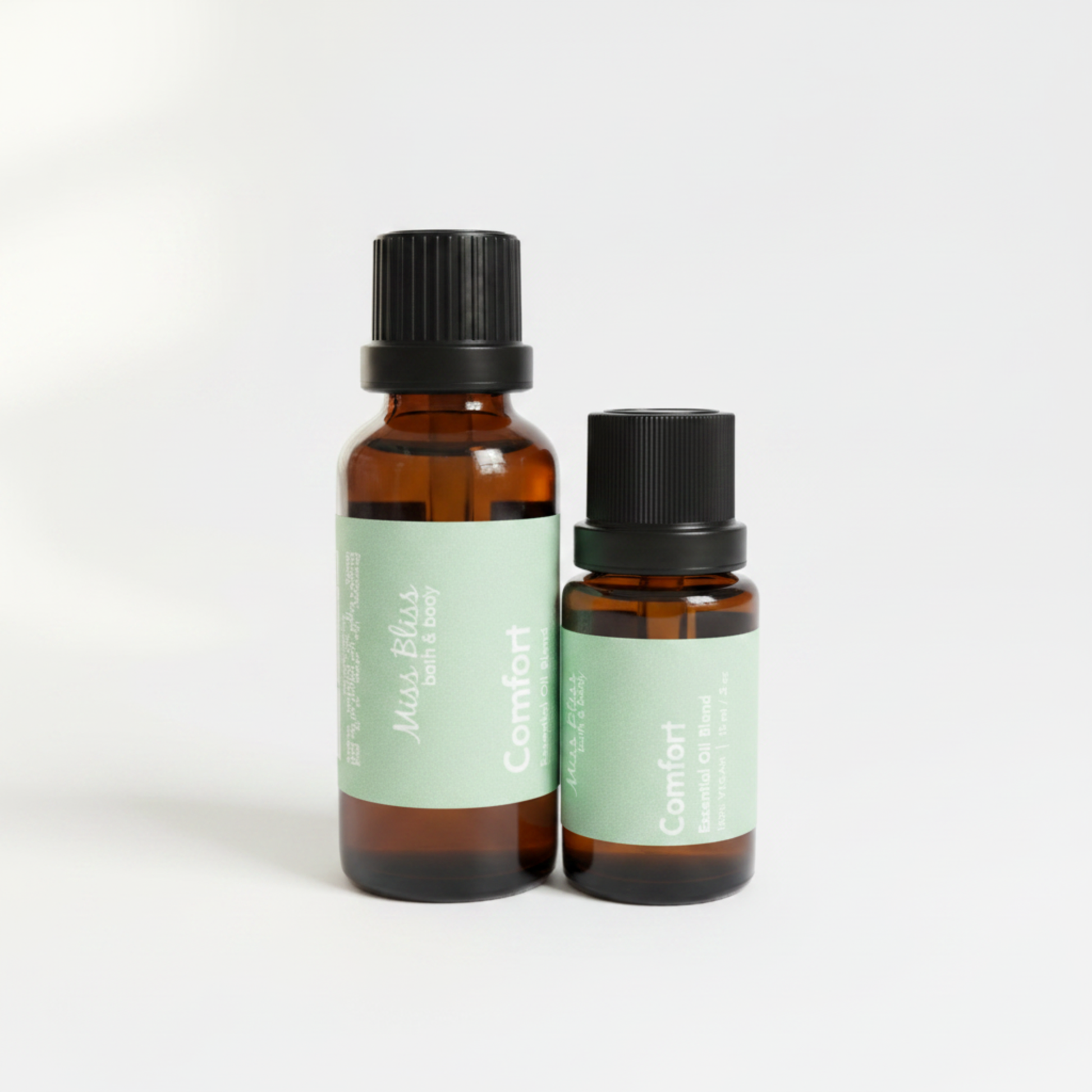 Comfort Essential Oil Blend — 30ml and 15ml amber glass bottles with green labels, 100% pure essential oils, handcrafted in Canada