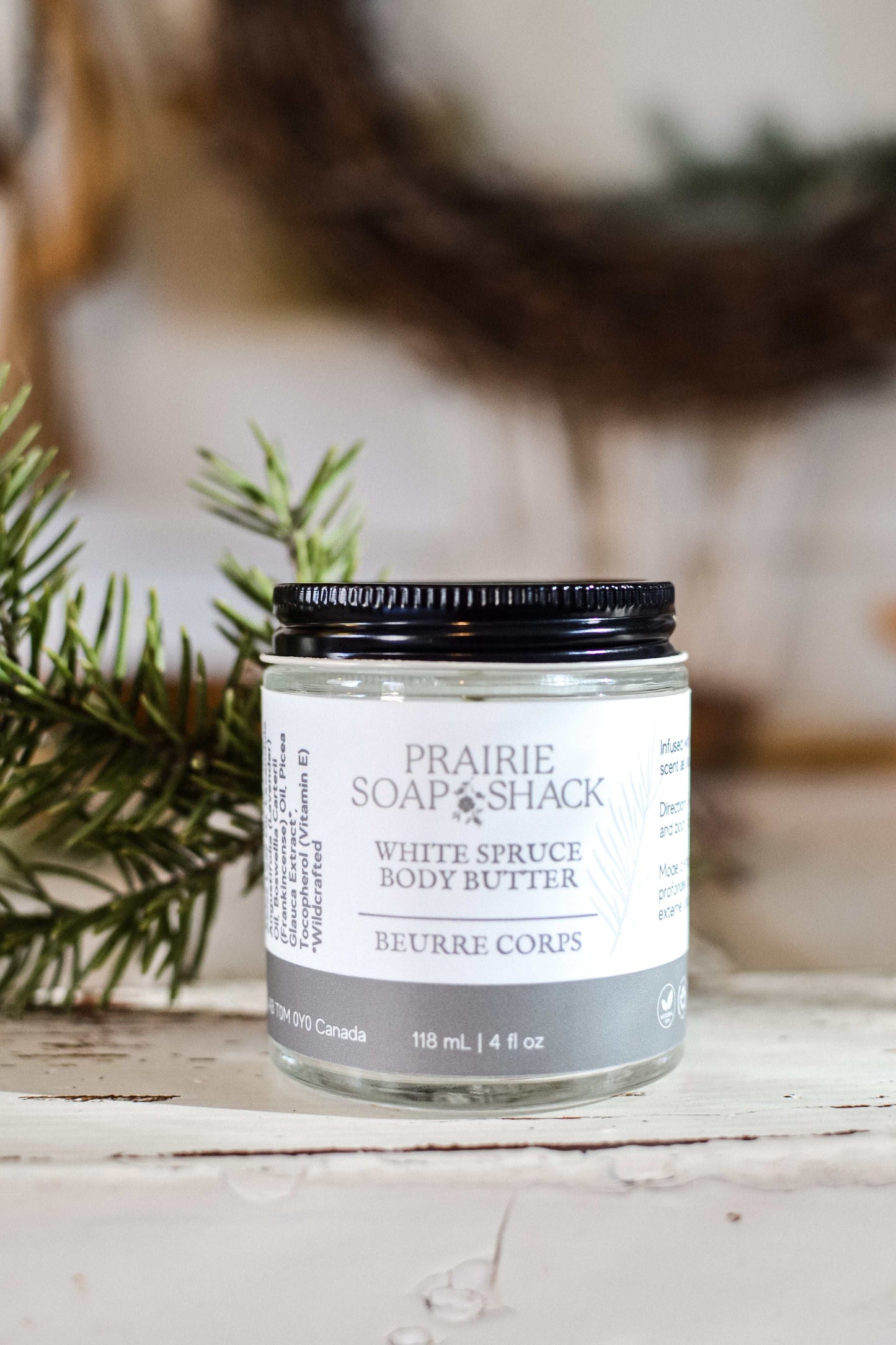 Natural white spruce body butter close-up showing rich creamy texture and jar detail