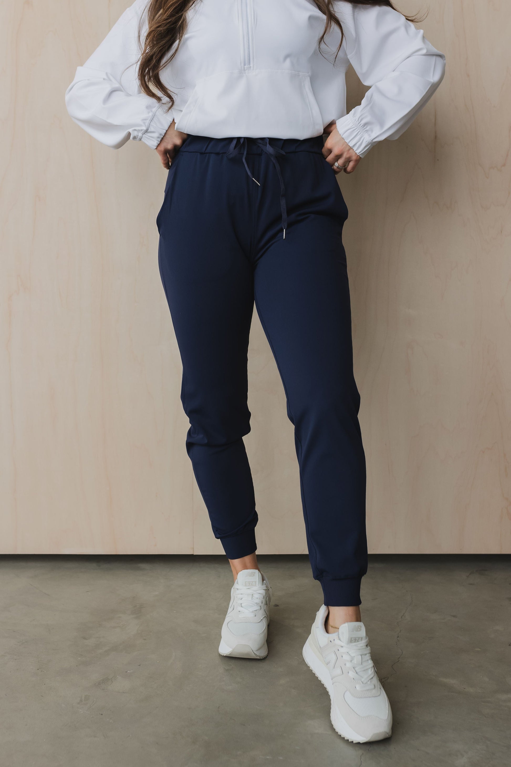 front view of a woman wearing cuffed ankle jogger in indigo for workouts and casual wear